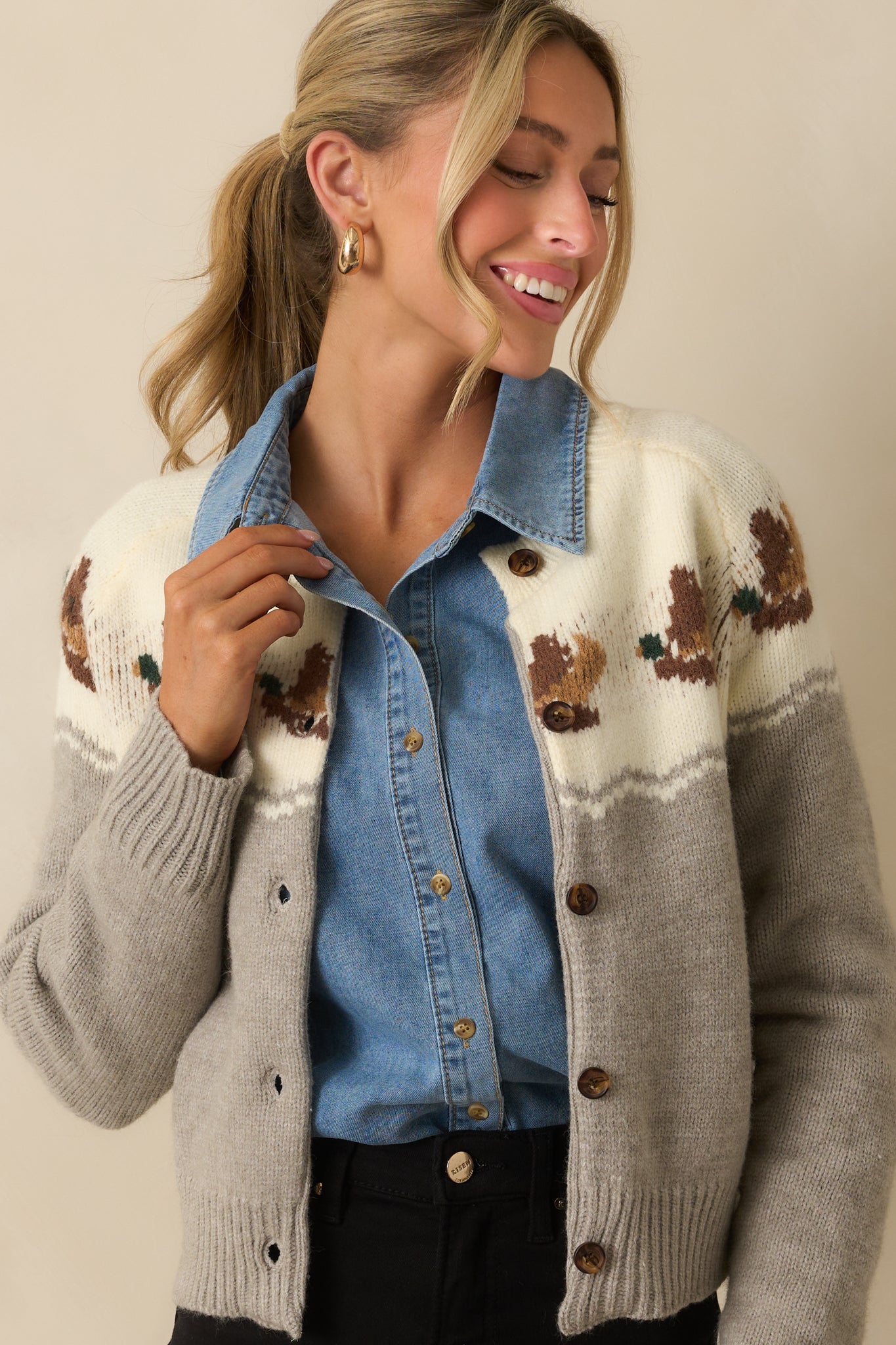 Cropped shot highlighting the textured knit pattern and duck motif.