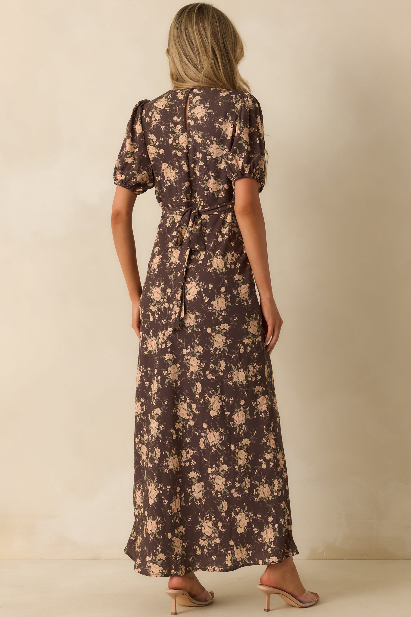 Rear view of the floral dress with self-tie waist and hidden zipper closure