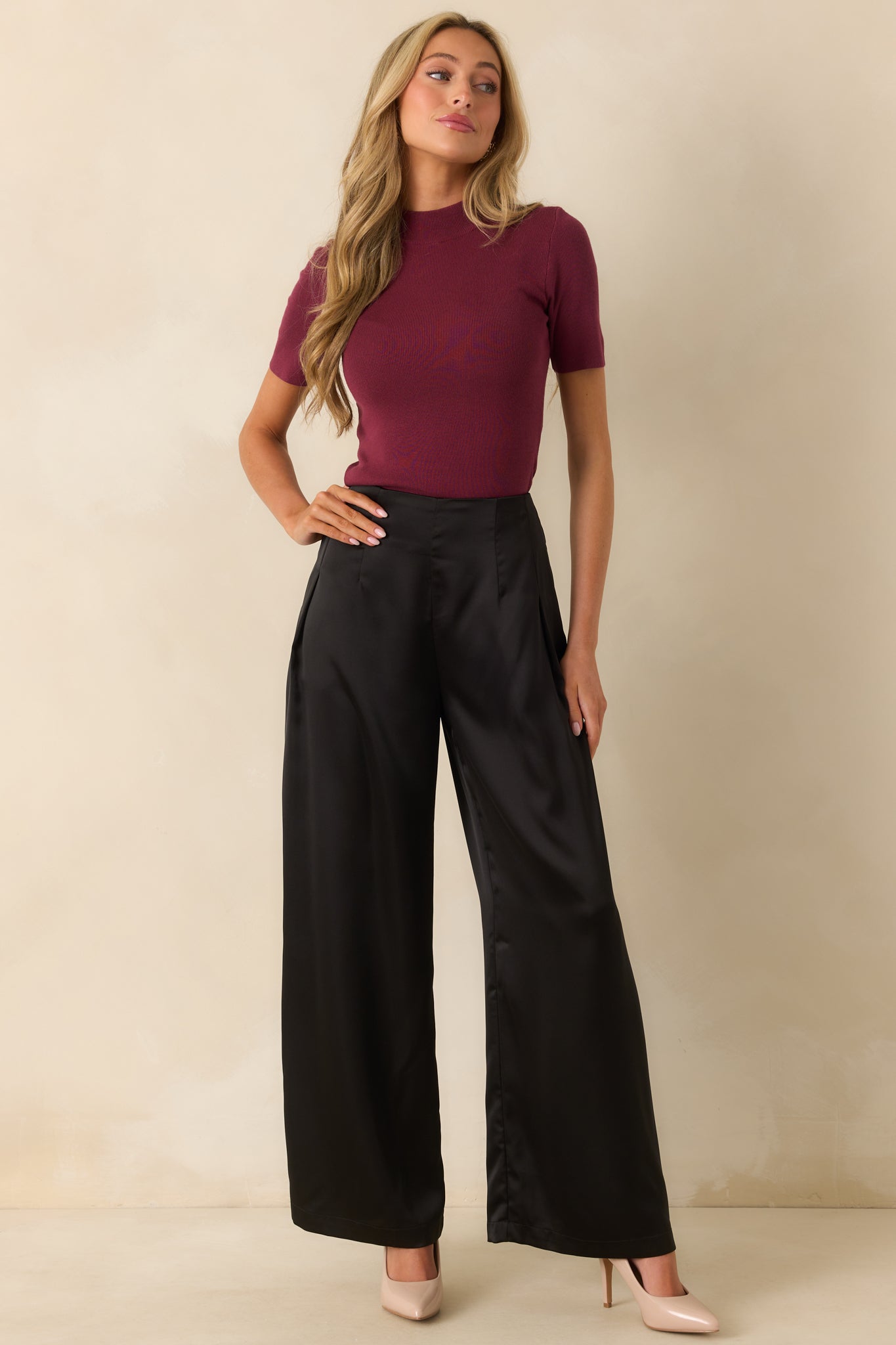 A full-length front view highlighting the smooth satin fabric and flowing wide leg cut.