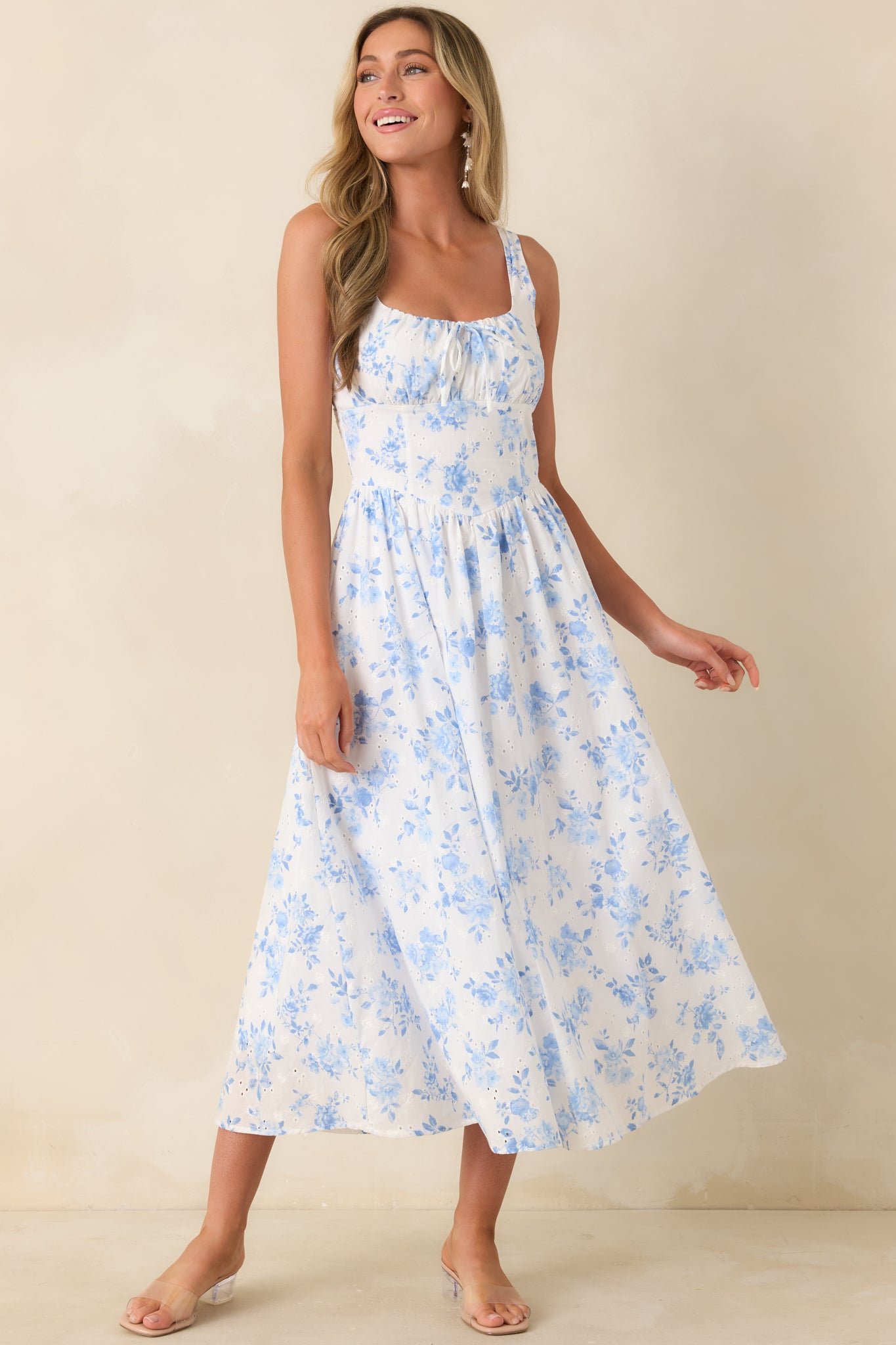 Peasant-style dress with gathered bodice and subtle tie-front detail in a relaxed silhouette.