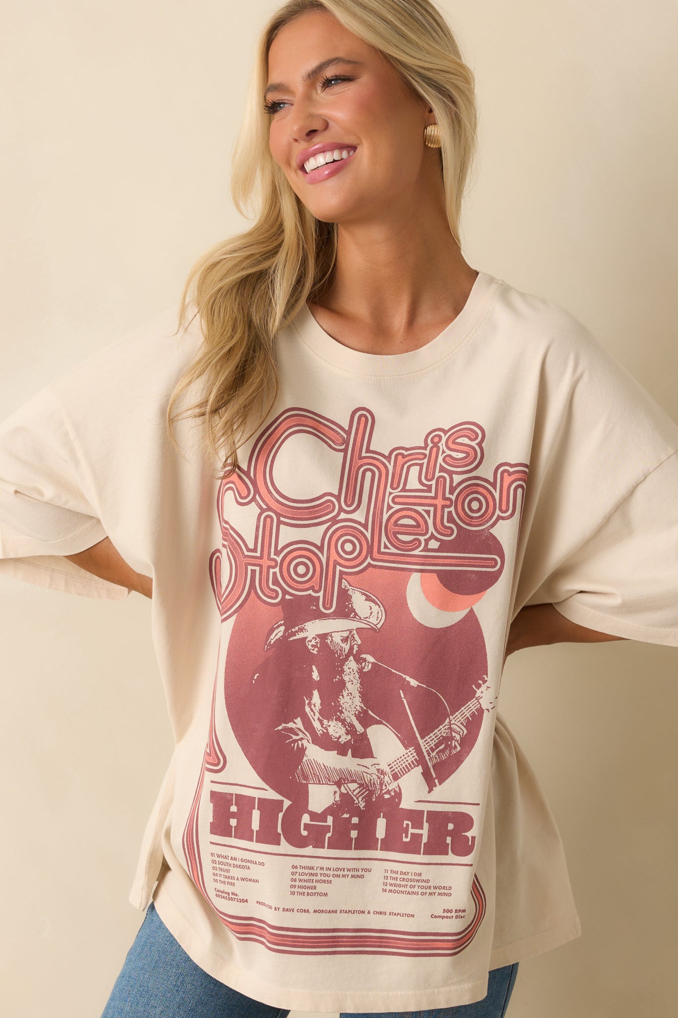 Front close-up showing the graphic print and relaxed oversized silhouette across the chest