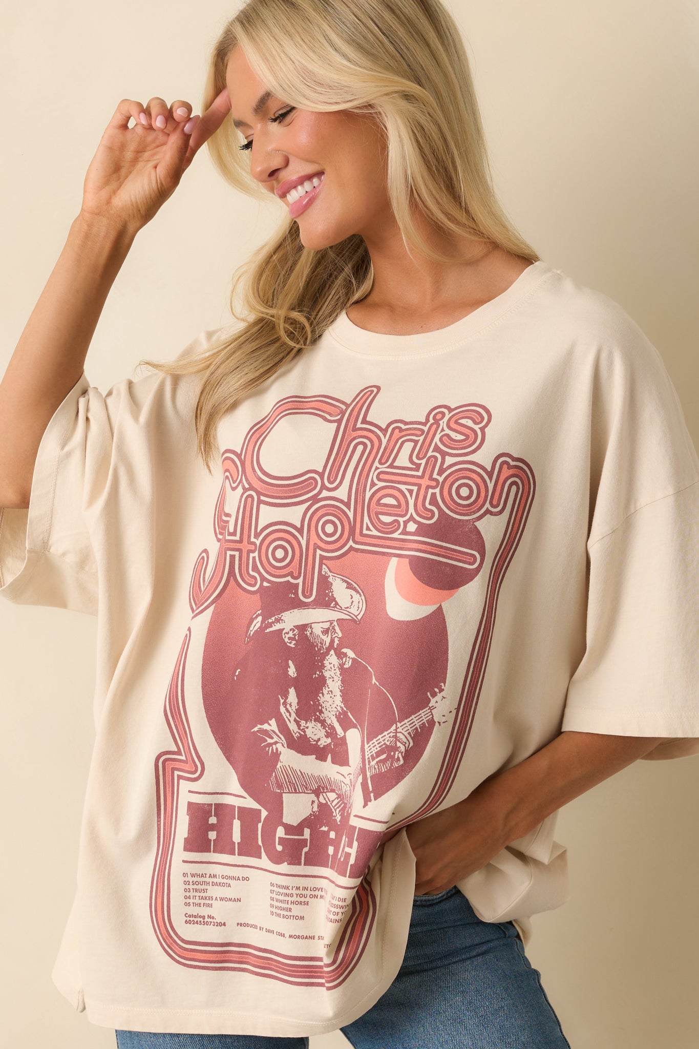 Close view of the maroon-toned Chris Stapleton tour graphic on the front of the ivory tee.