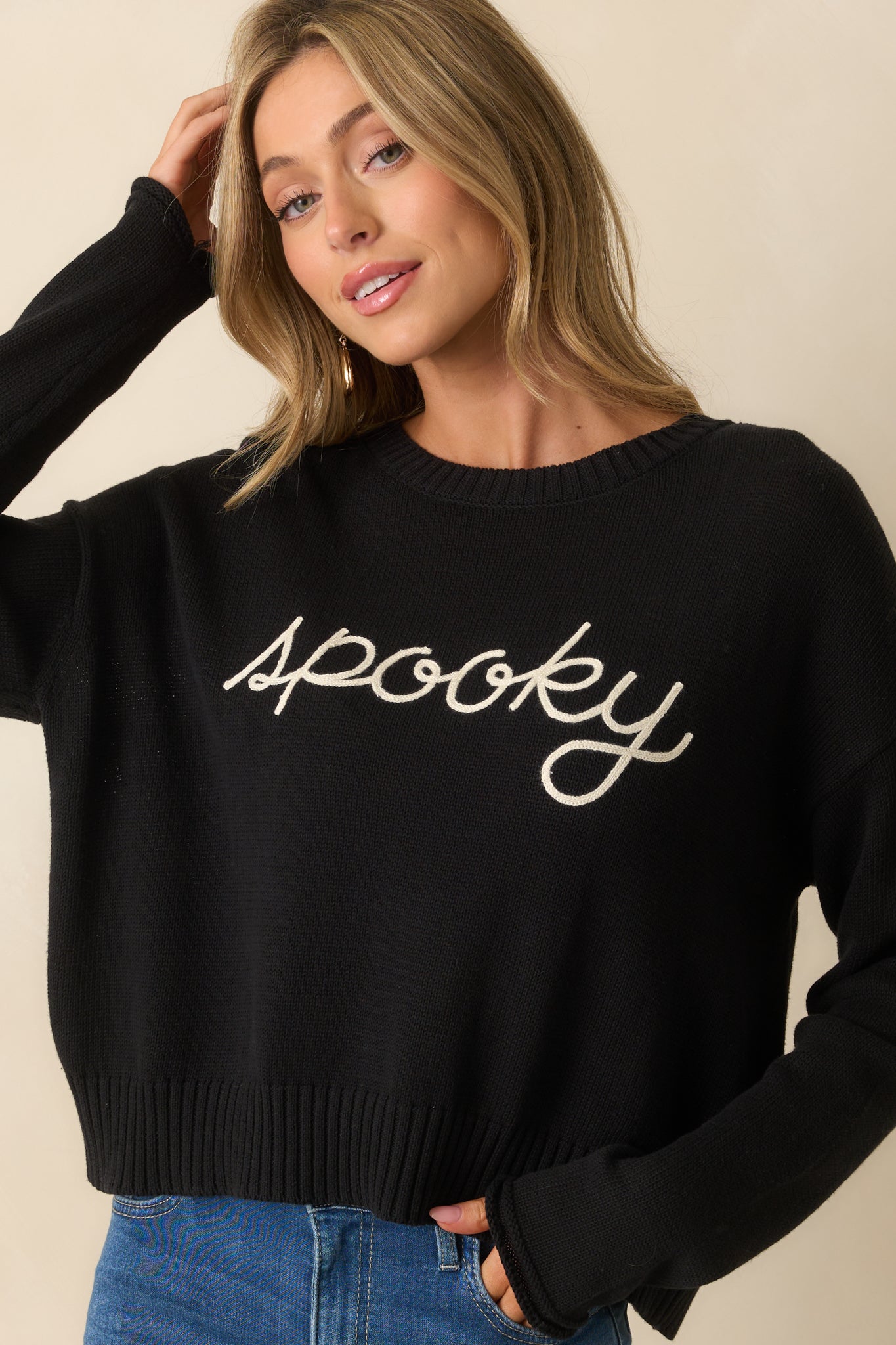 Ribbed hem and cuffs adding texture to the cozy pullover sweater.