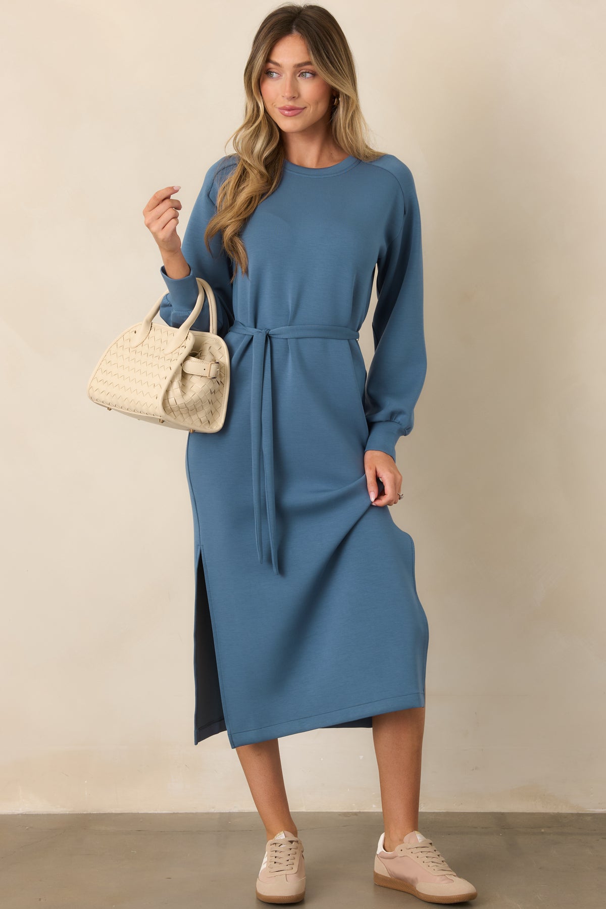 Blue long sleeve midi dress with a crew neckline, relaxed fit, and self-tie waist