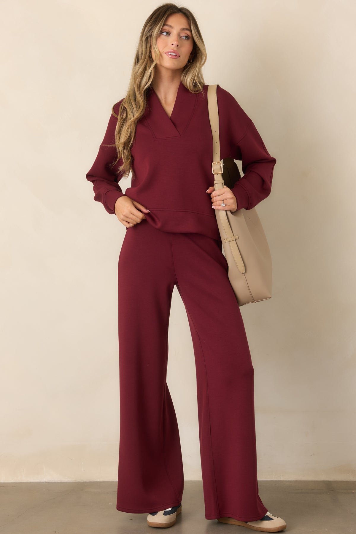 Wine red sweatshirt with berry undertones, dropped shoulders, and banded sleeve cuffs