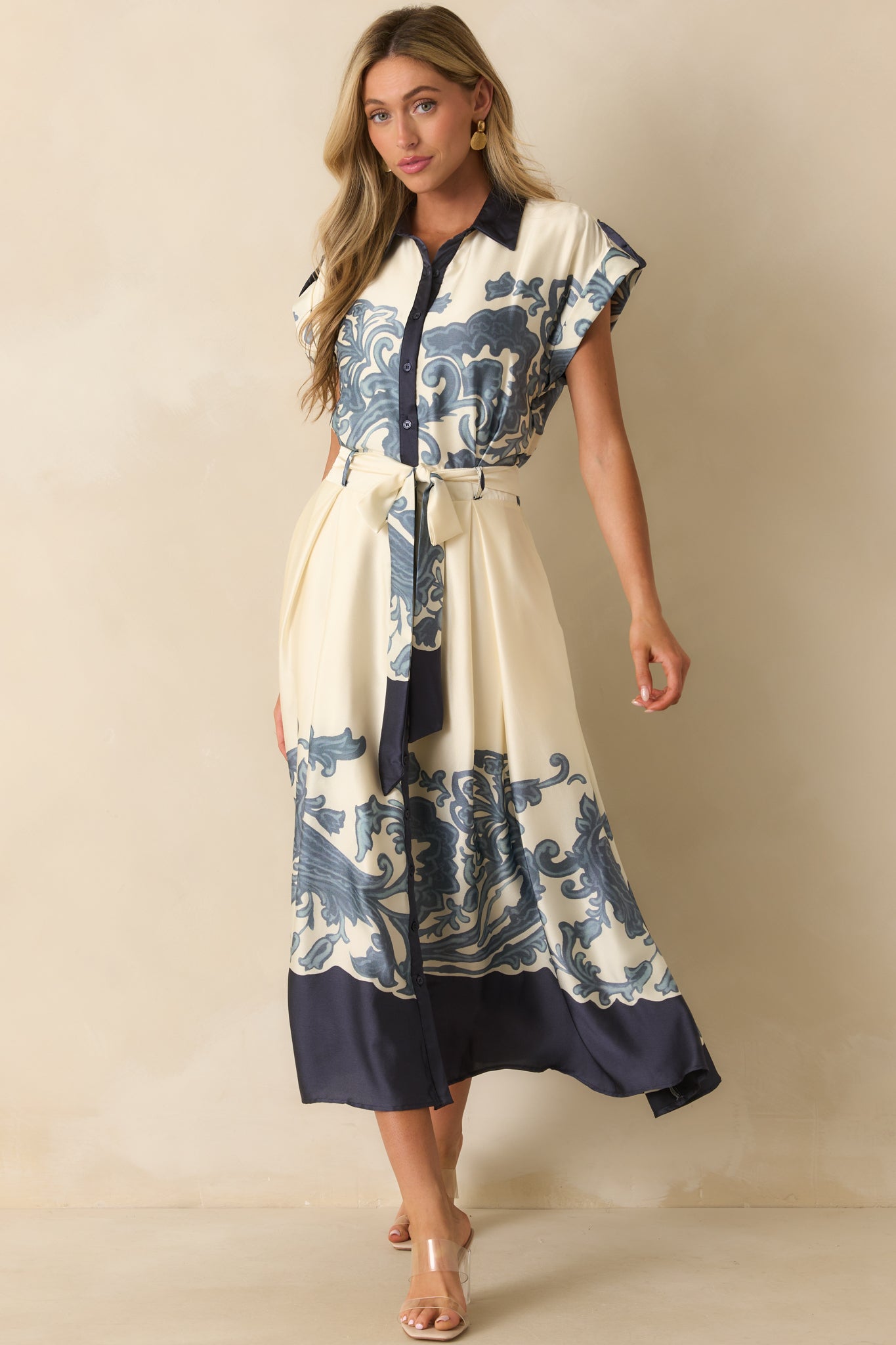 Ivory maxi dress highlighting elastic back waistband insert and functional side pockets for added detail.
