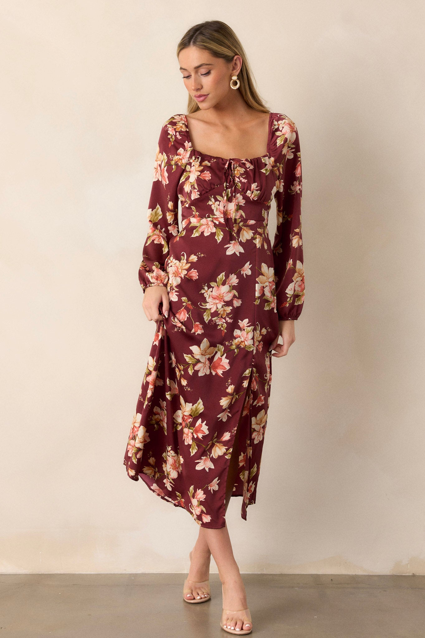 Full-length view from the side, showcasing the leg slit and how it adds movement and allure to the overall look.