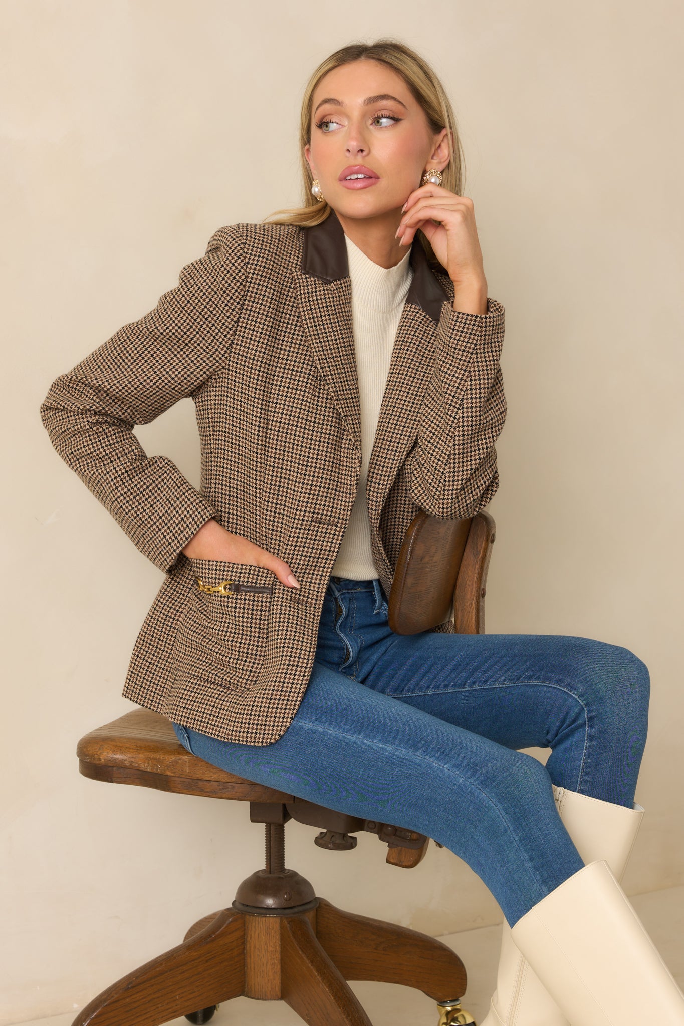 Cropped front view highlighting the faux leather notched collar and gold bit hardware at the pockets.