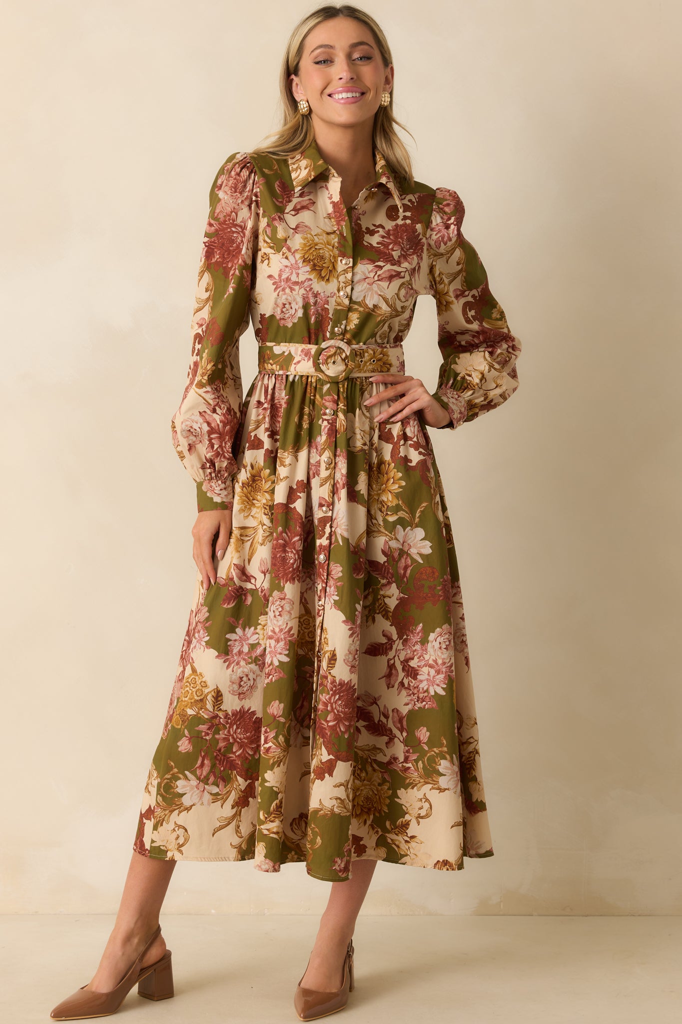 Floral print olive green dress with a collared neckline, optional waist belt, and functional pockets, displayed from the front.