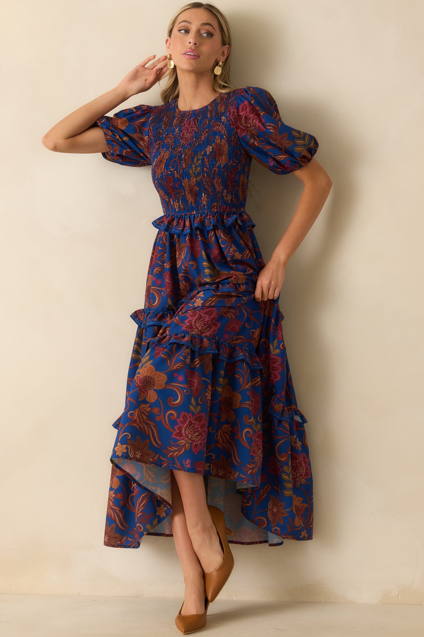 Navy maxi dress with a fully smocked bodice and multicolor floral paisley print.