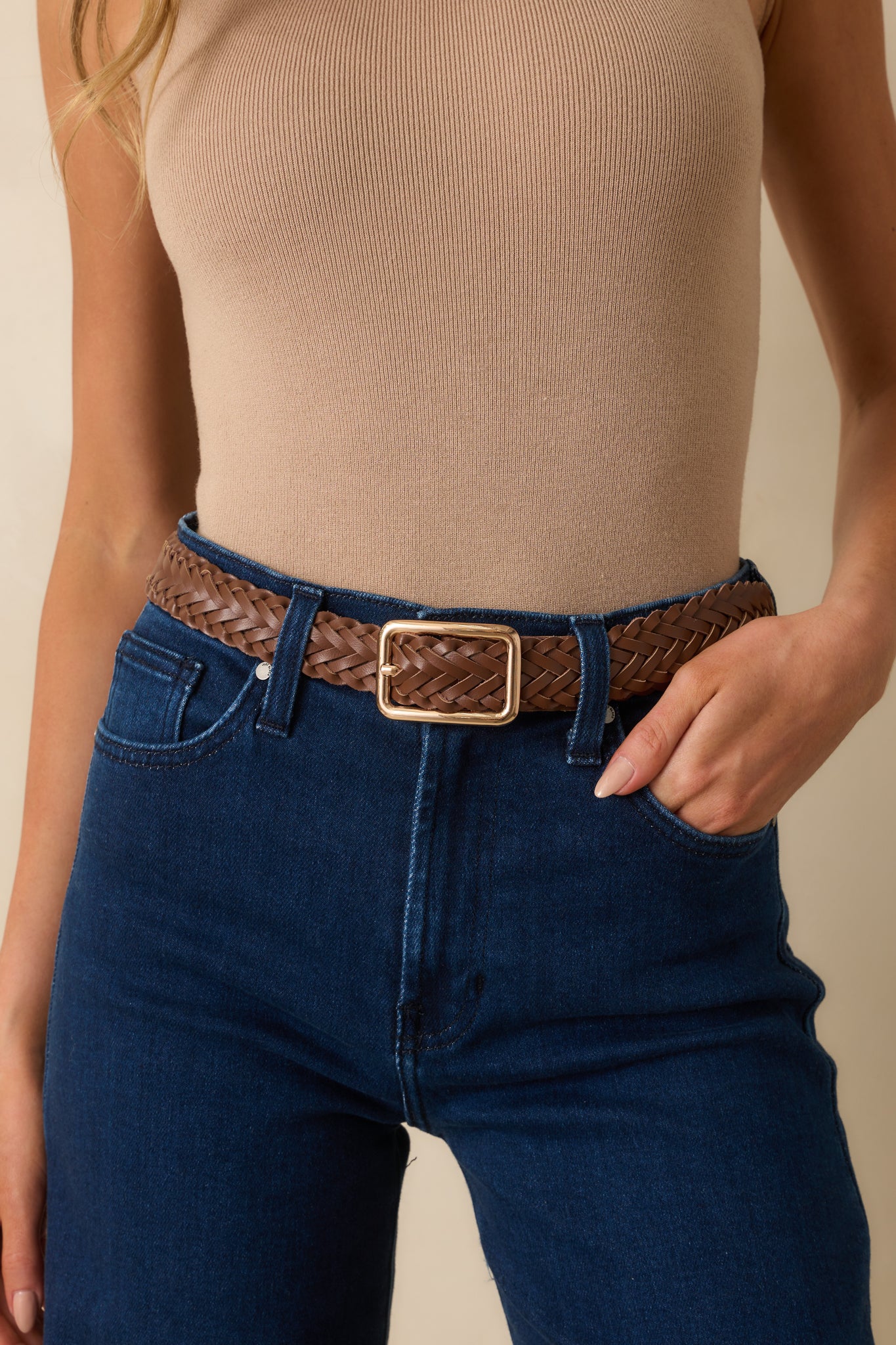 Cropped view highlighting the textured braided material and polished gold hardware.