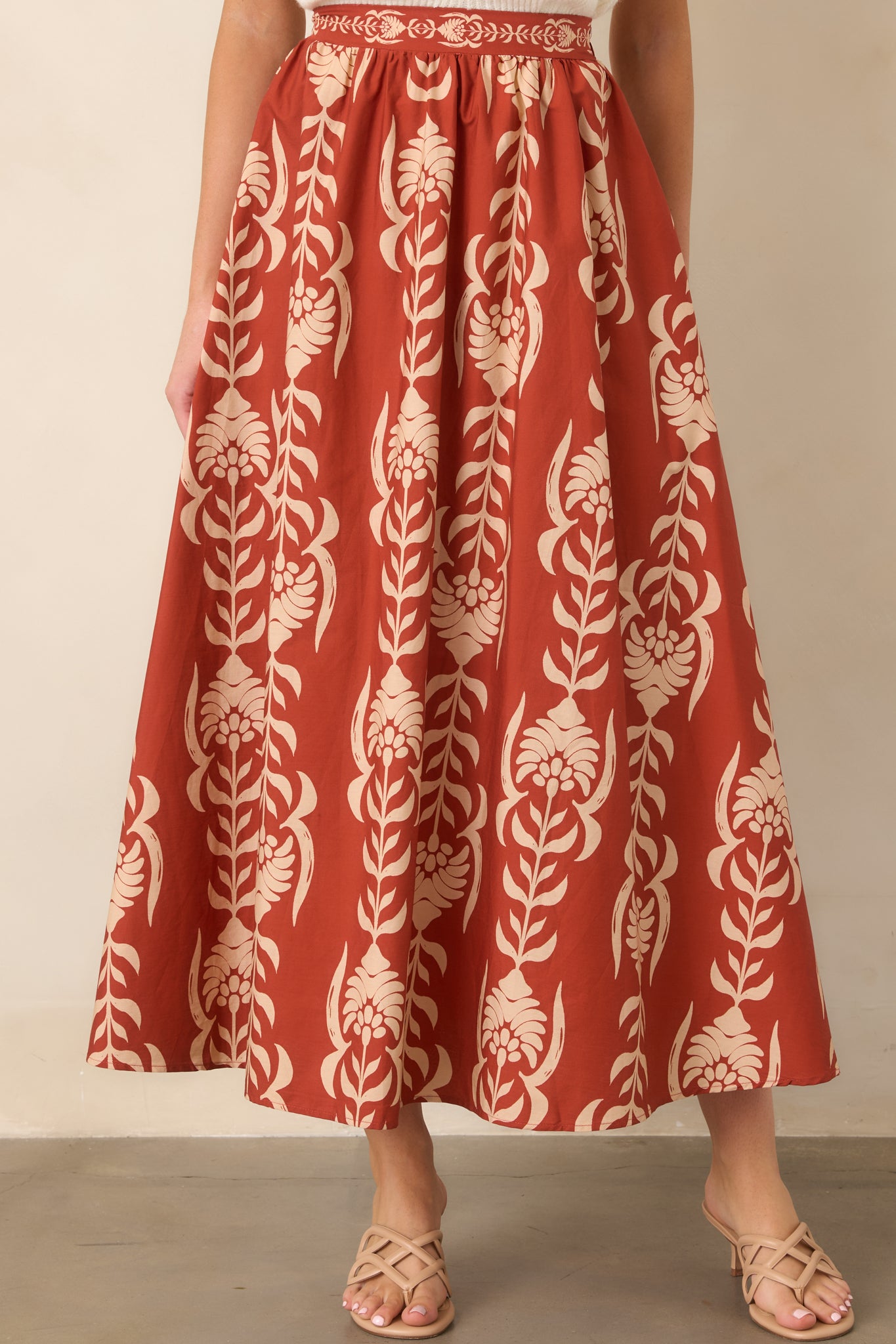 A-line cotton skirt featuring a streamlined waistband and gently widening shape for an easy, relaxed finish.
