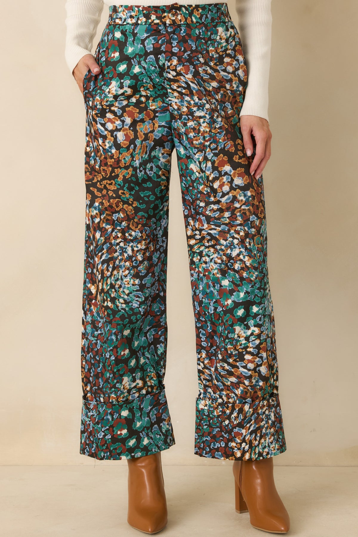 Abstract animal print pants showcasing functional side pockets and a cropped straight-leg silhouette.