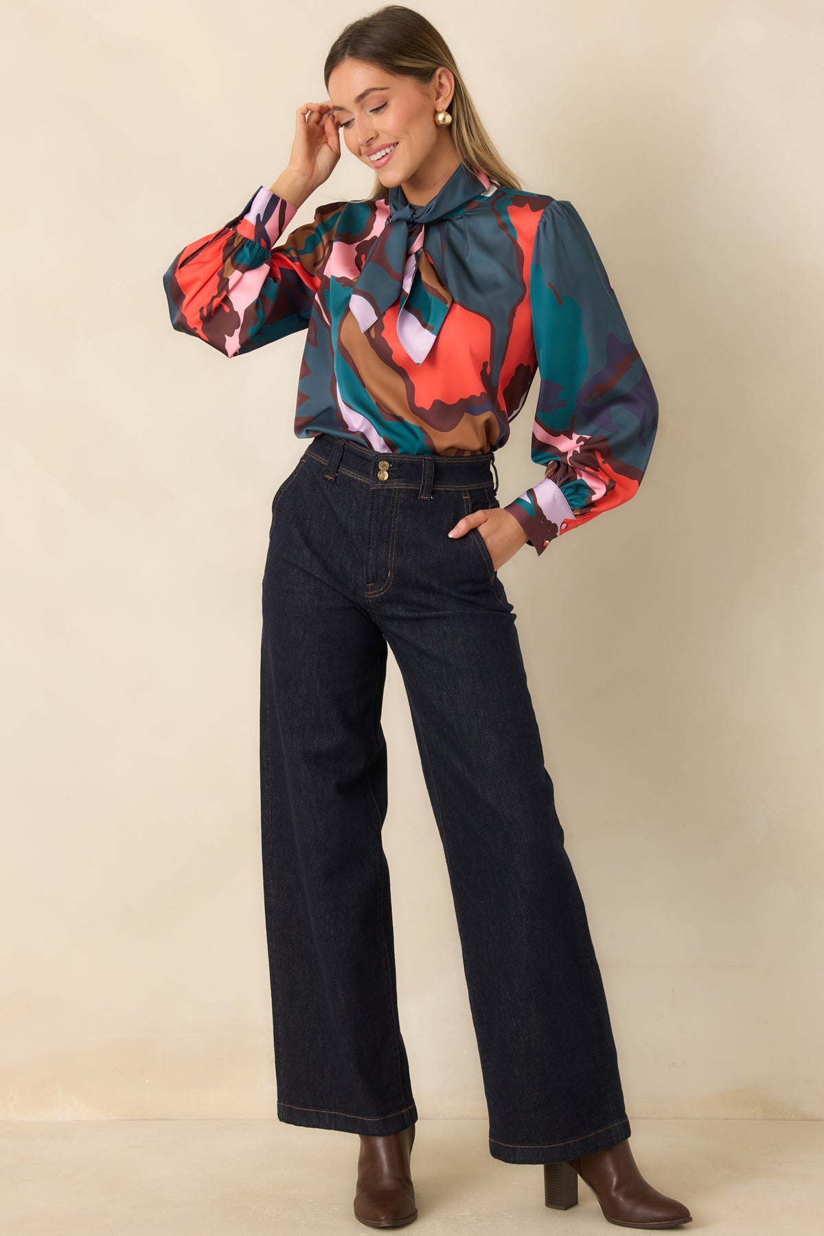 Abstract print blouse with gathered neckline detailing and softly voluminous puff shoulders.