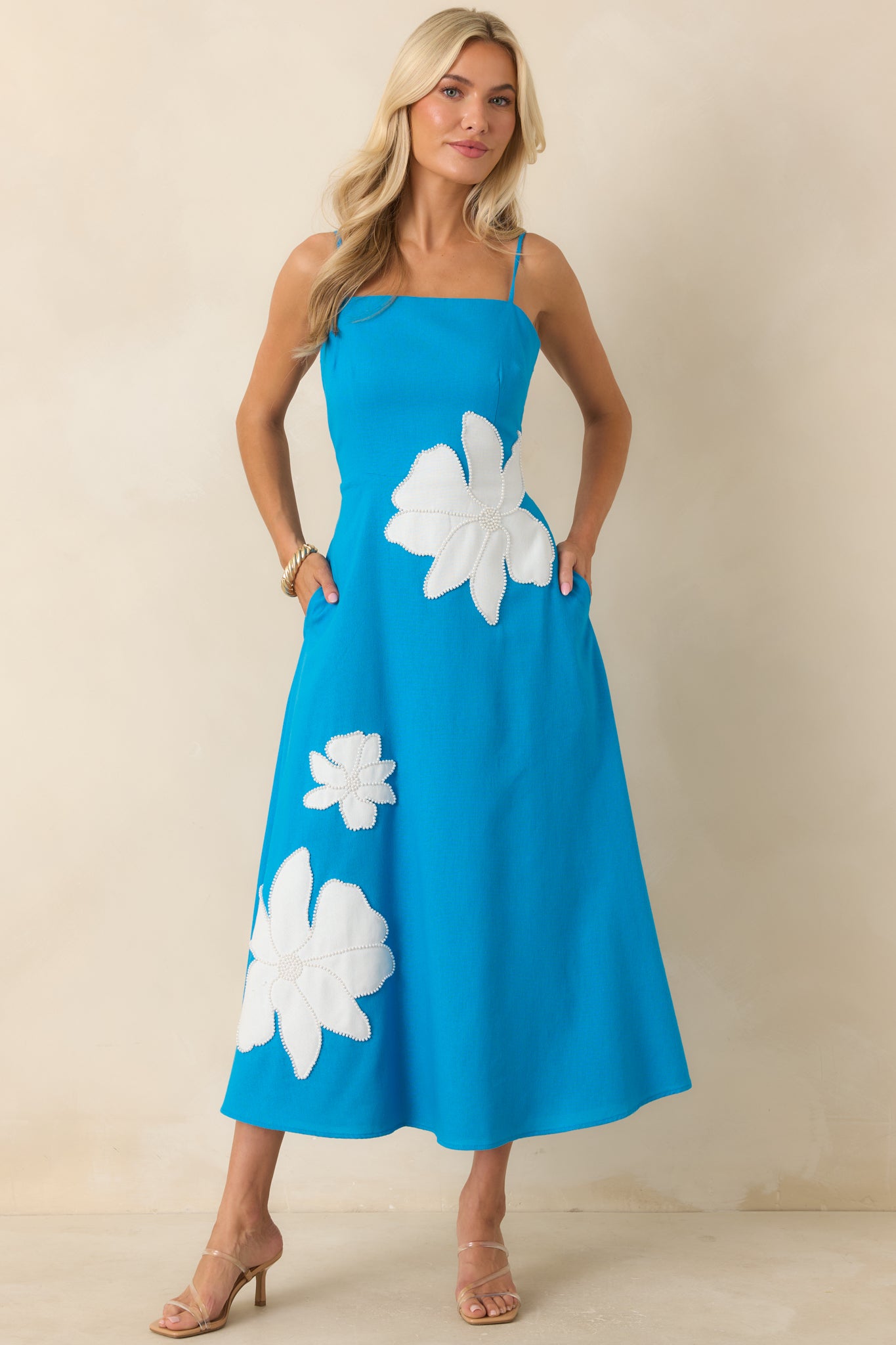 Lightweight lined midi dress with adjustable straps, a flattering fitted shape, and an easy A-line silhouette.