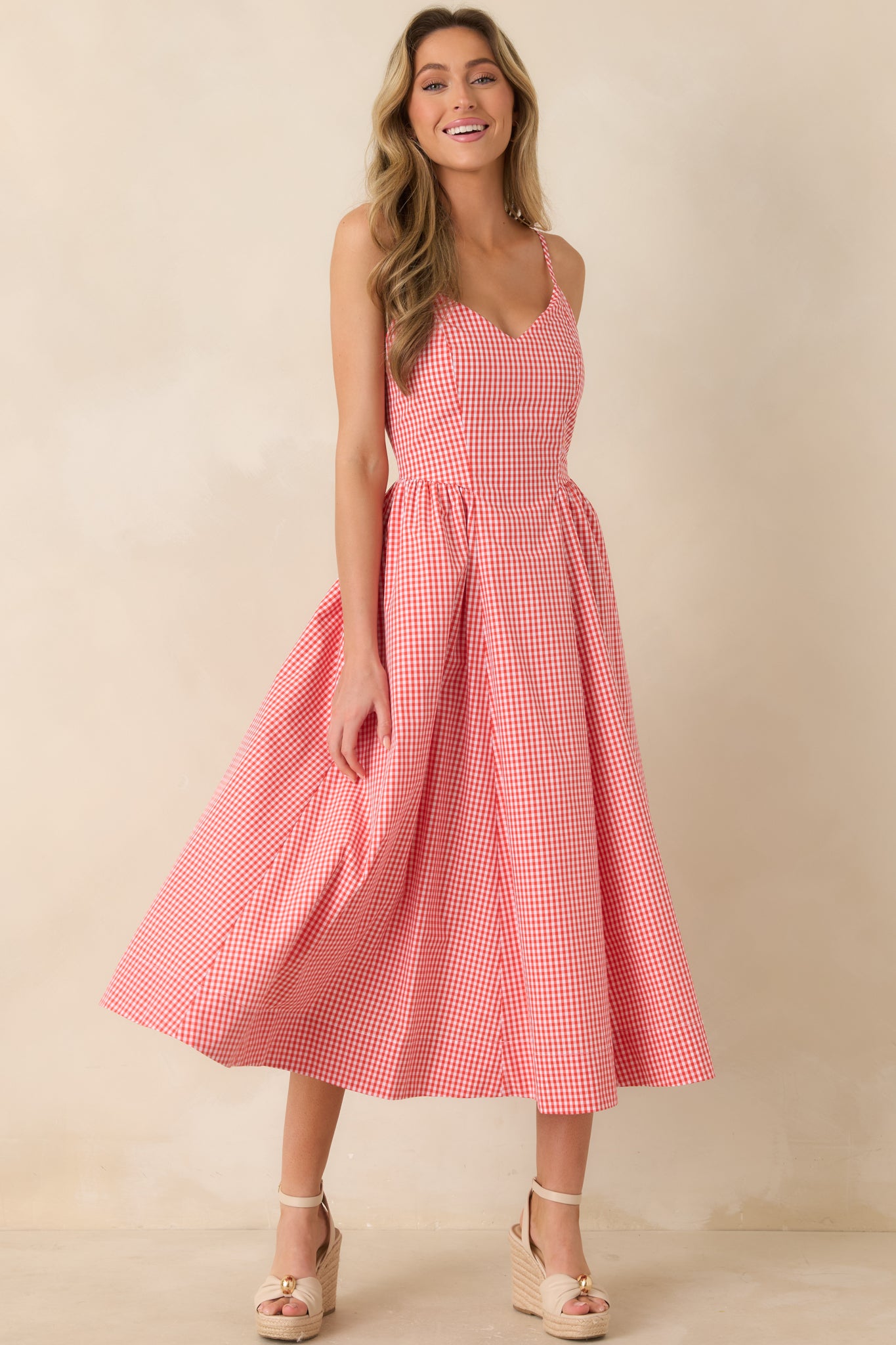 Airy striped midi dress featuring soft drape and elegant midi-length finish.