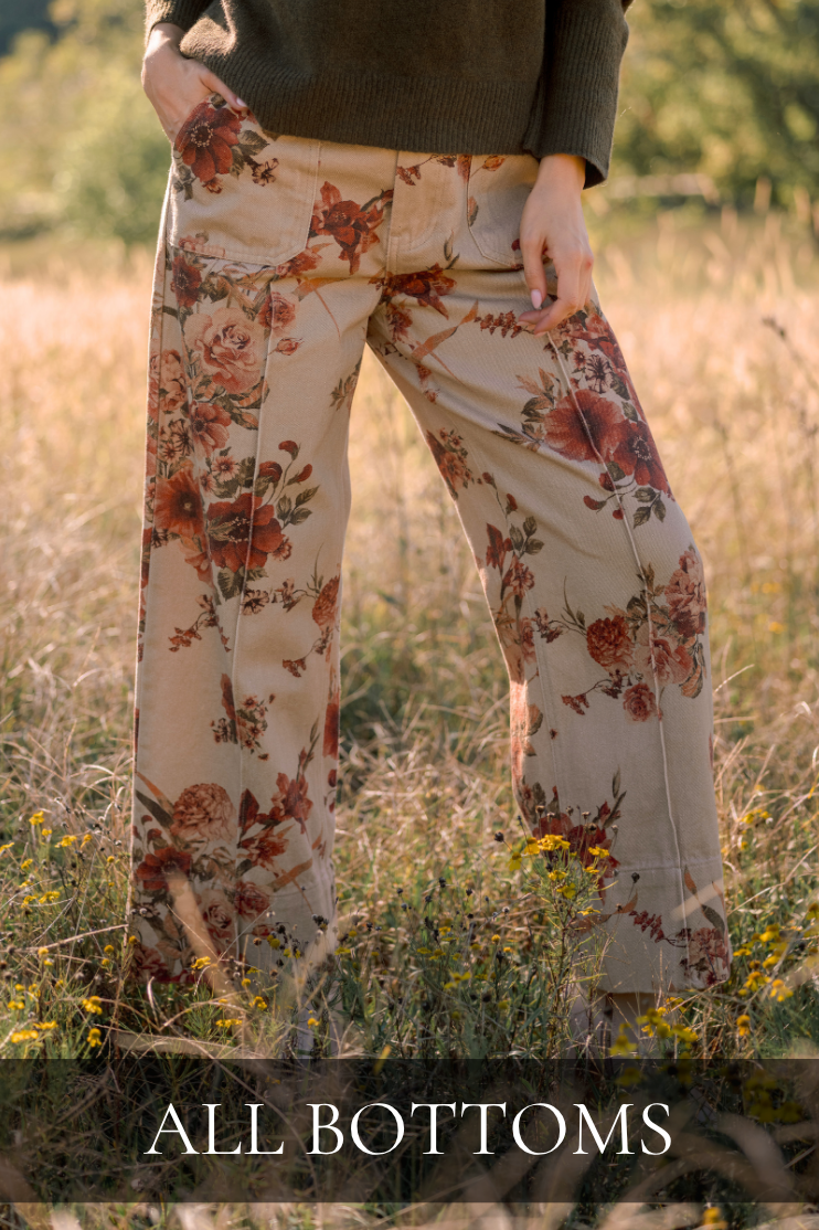 Model wearing floral pants. Text reads: "All Bottoms."