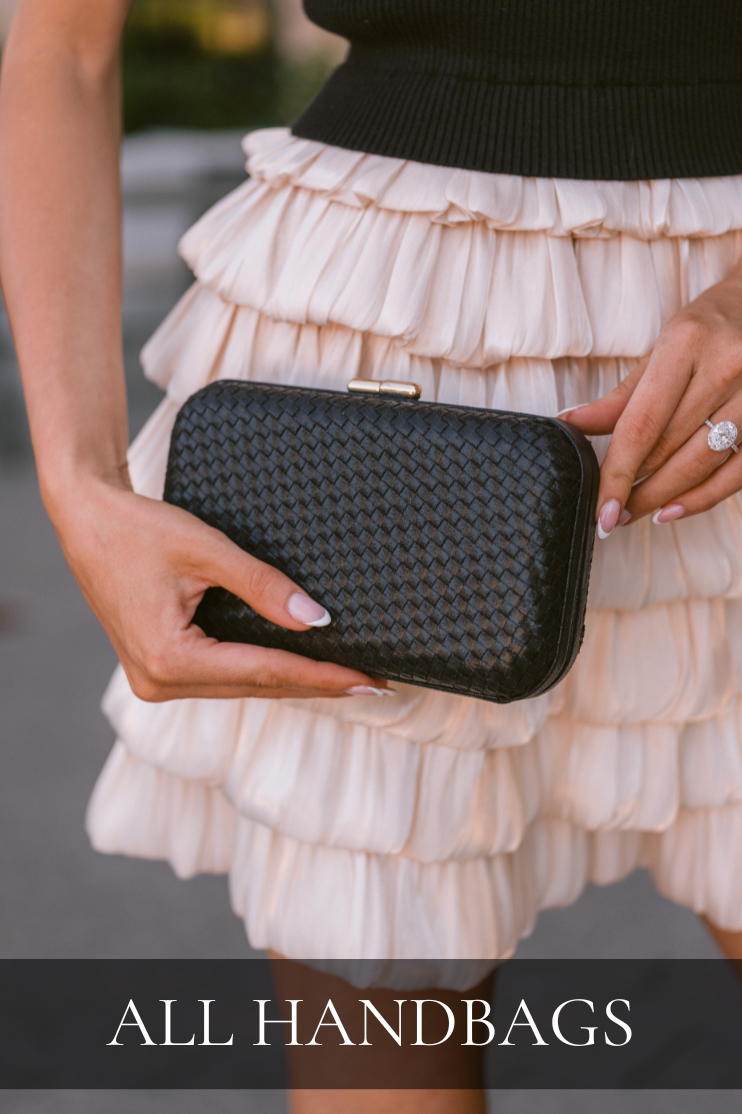 Women’s boutique handbags featuring a woven black clutch styled with a feminine ruffled skirt.