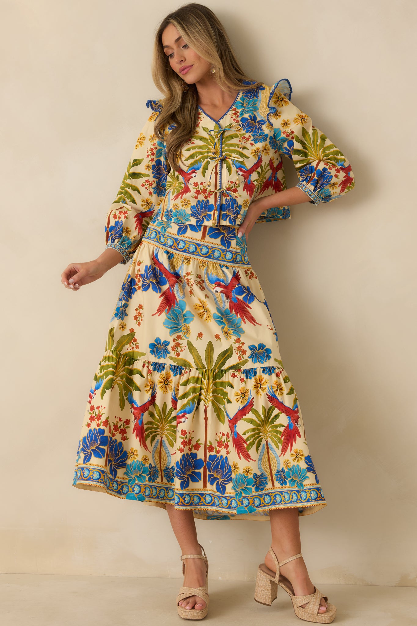Front angle emphasizing ruffled shoulder details, cropped hem, and easy warm-weather fit.