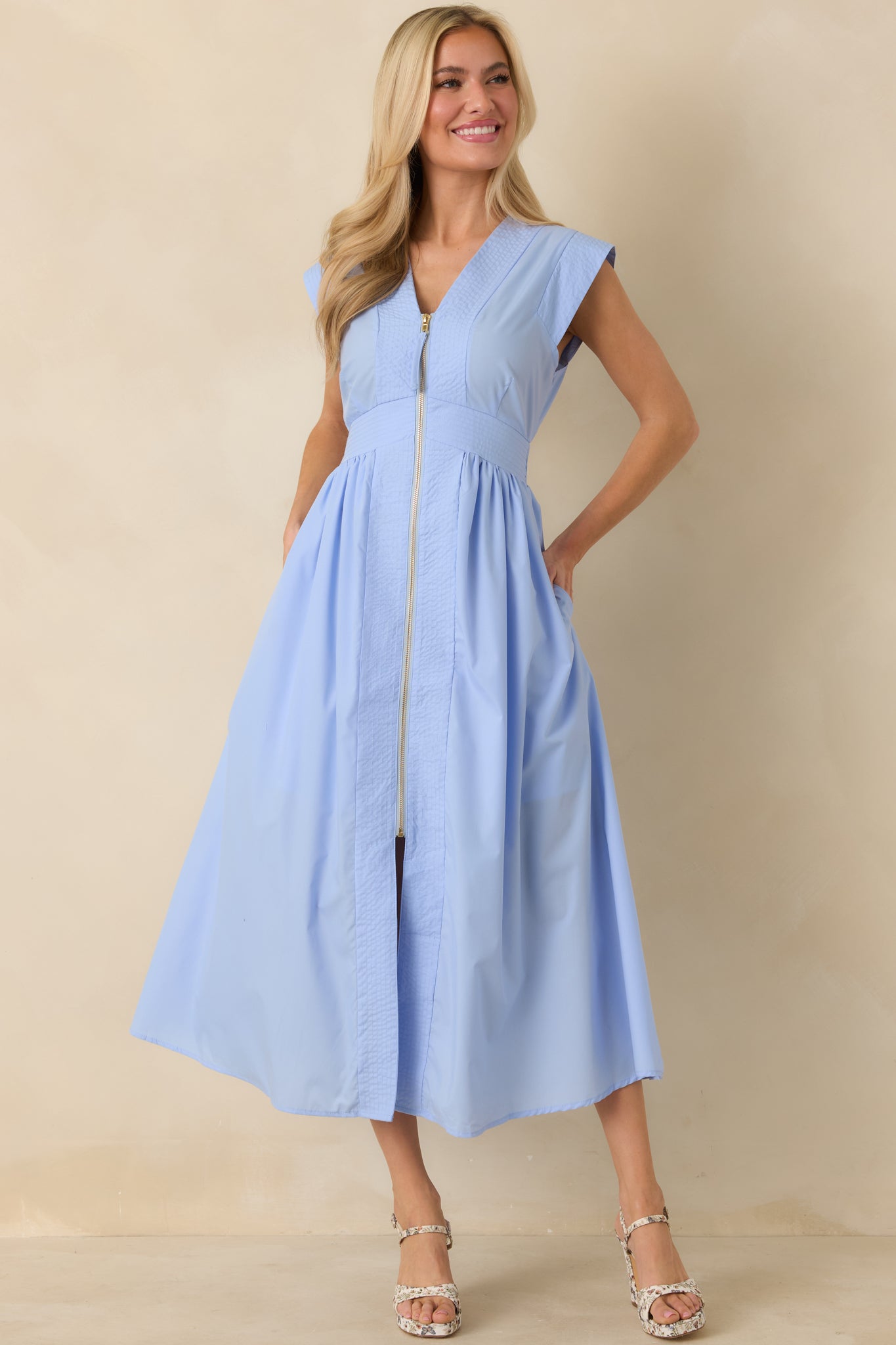 Front angle highlighting the overall silhouette, gold-tone zipper detail, and midi-length hemline.