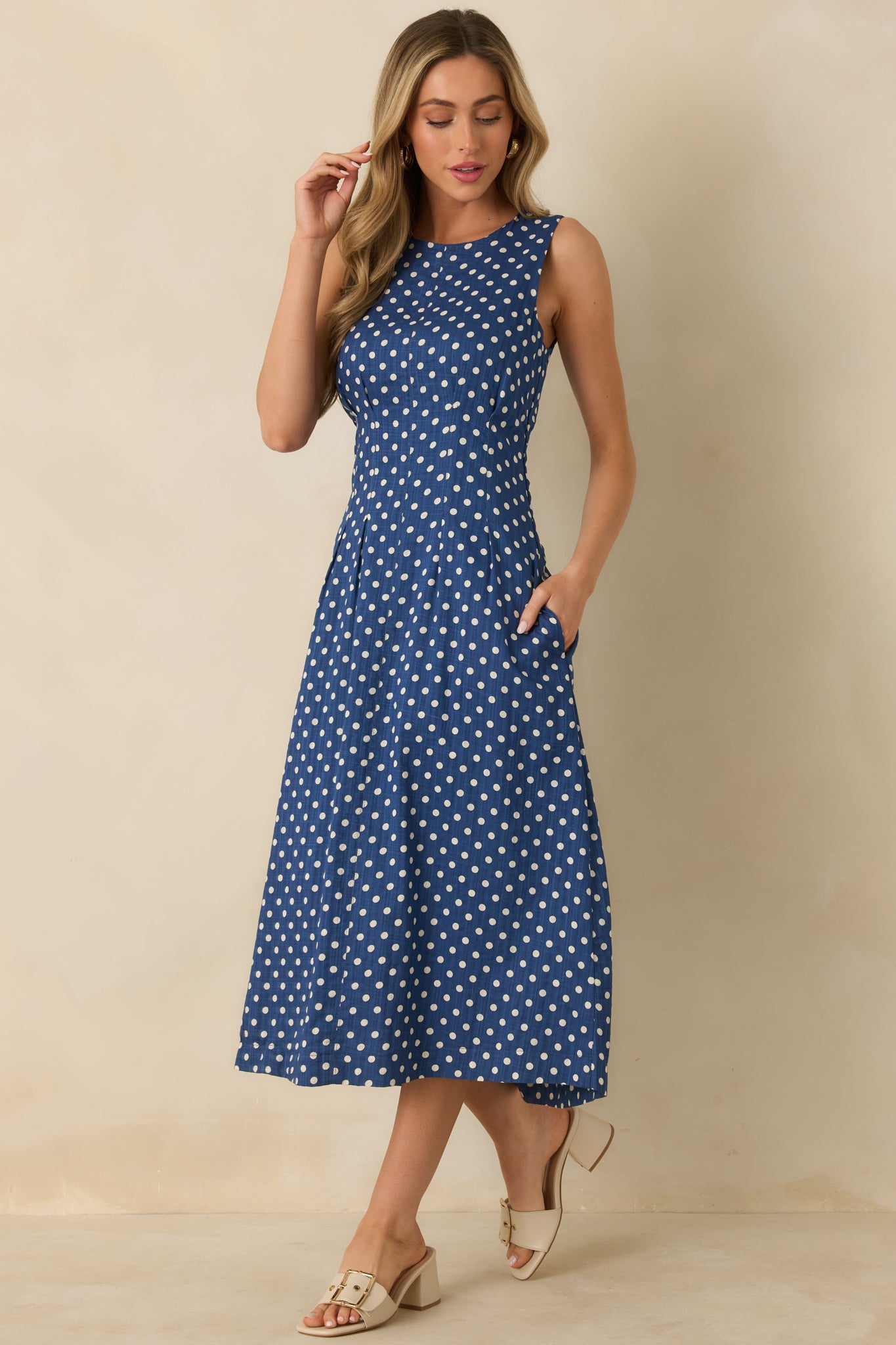 Angled front view highlighting fitted bodice with front darts and flared hemline.