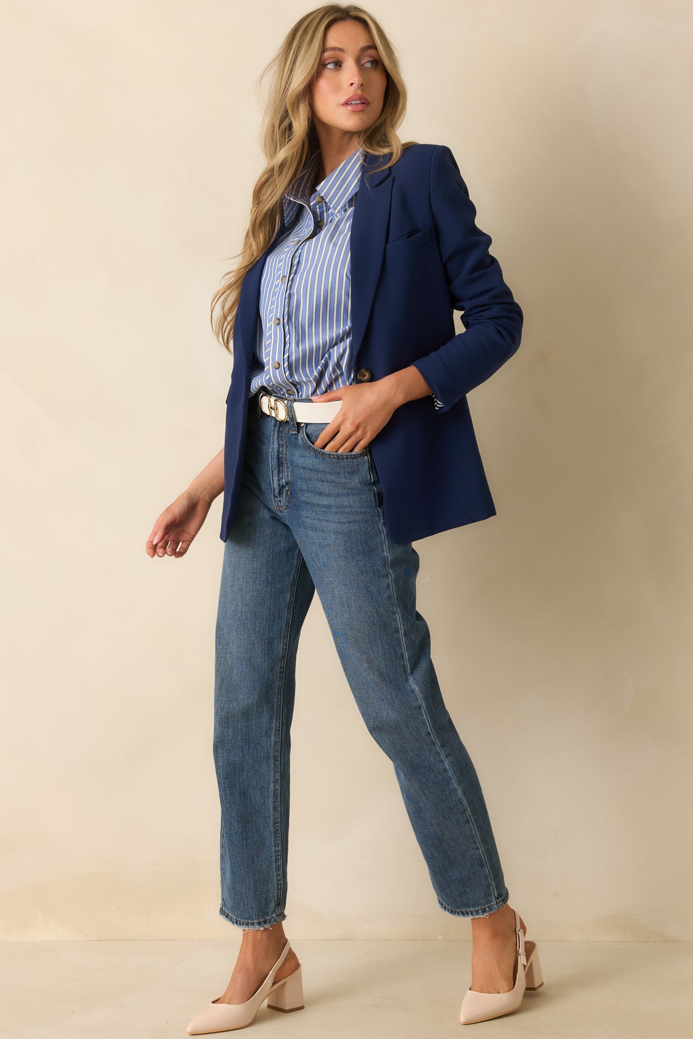 Angled front view highlighting the blazer’s tailored fit and long sleeve design.