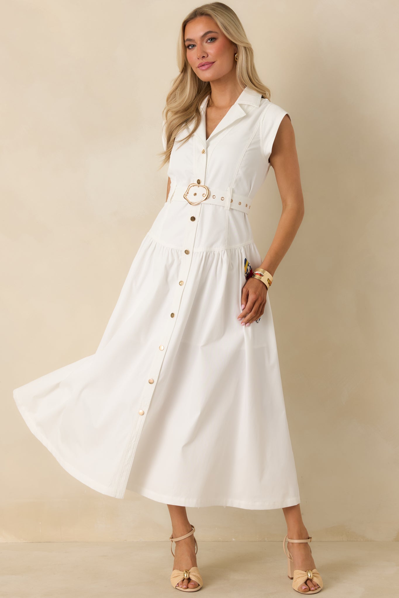 Angled front perspective highlighting the fitted waist, removable white belt, and softly gathered maxi skirt.