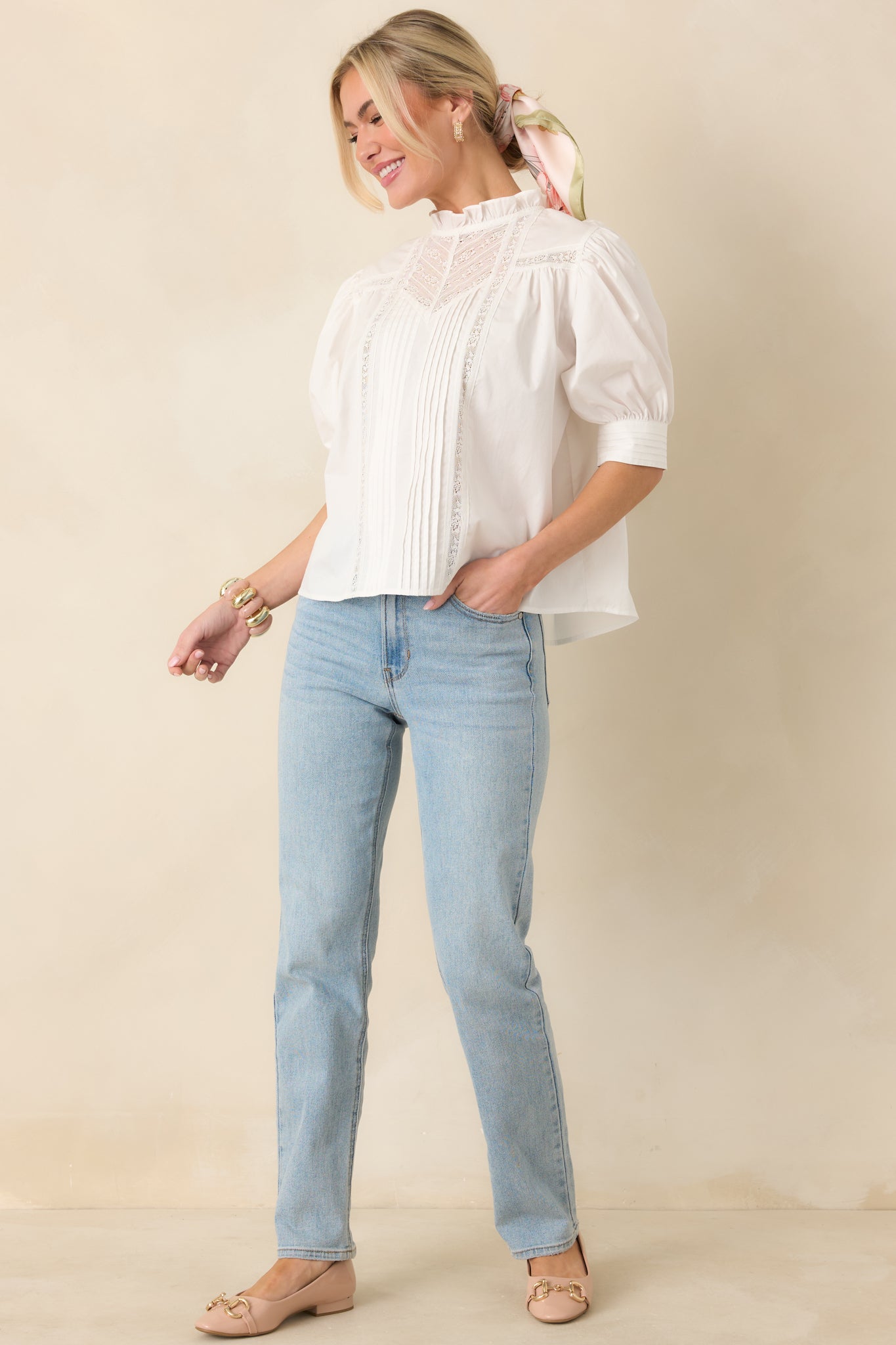 Angled front view highlighting the puff sleeves with banded cuffs and relaxed boxy silhouette.