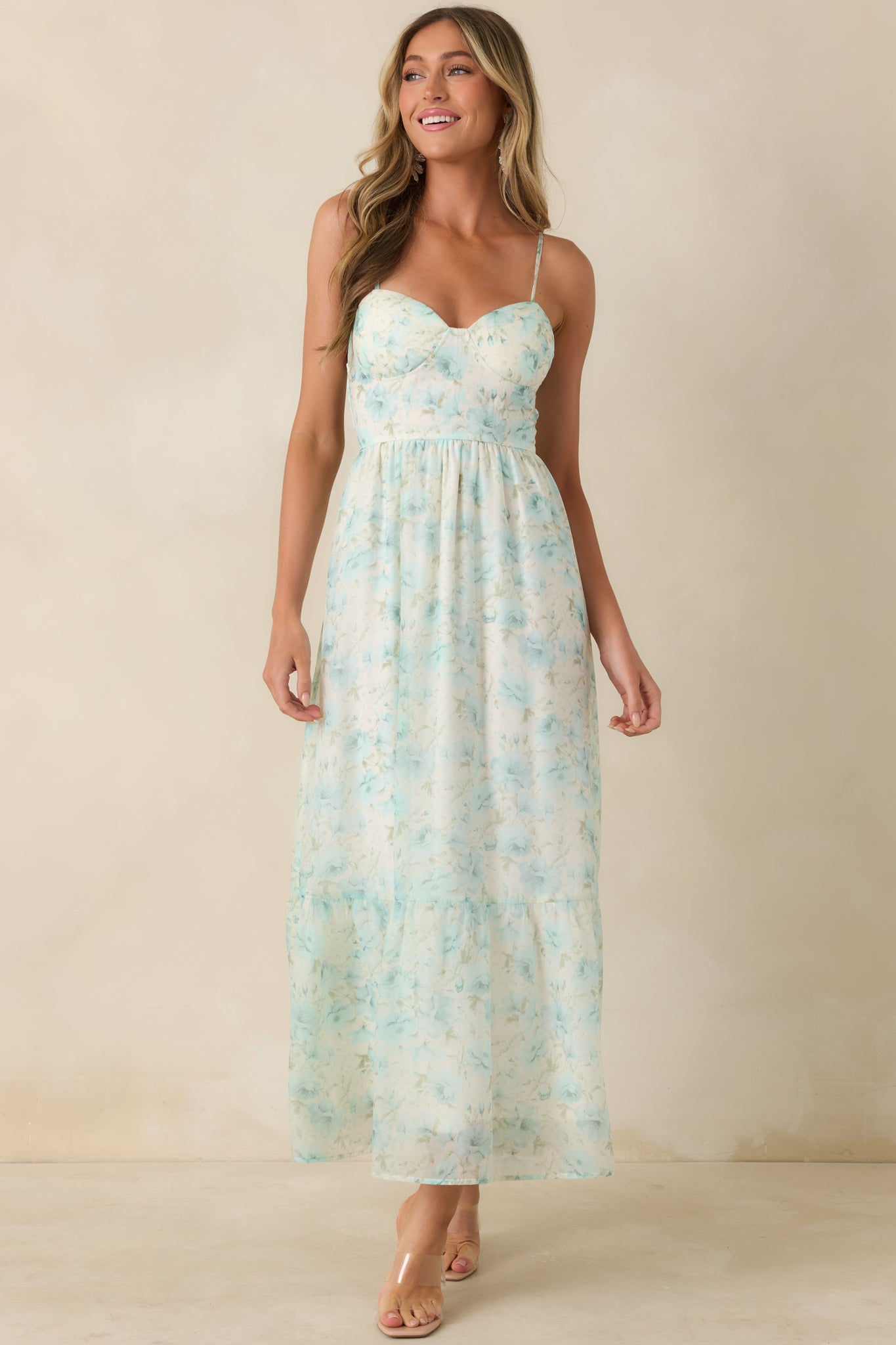Aqua blue floral midi dress with bustier-style bodice and adjustable spaghetti straps.