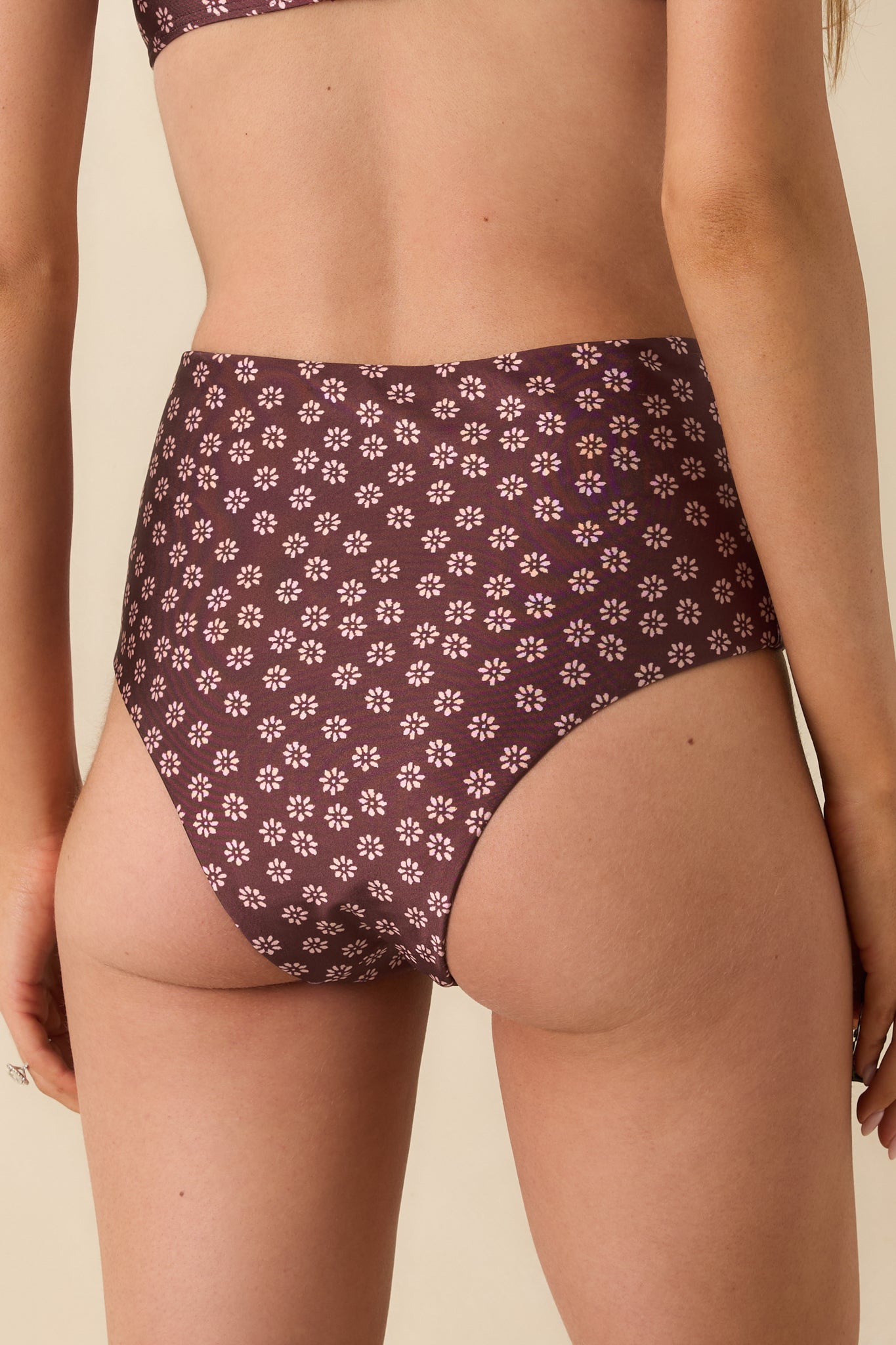 Back view of the burgundy floral bikini bottoms, highlighting their stretch fabric and comfortable coverage.