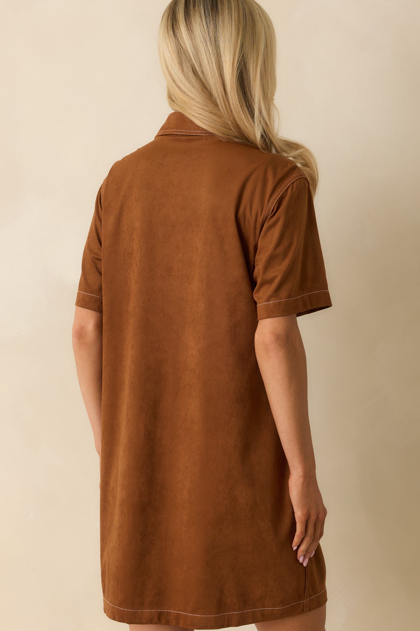 Back view of the cinnamon brown mini dress showing straight hemline, smooth fabric, and relaxed fit.
