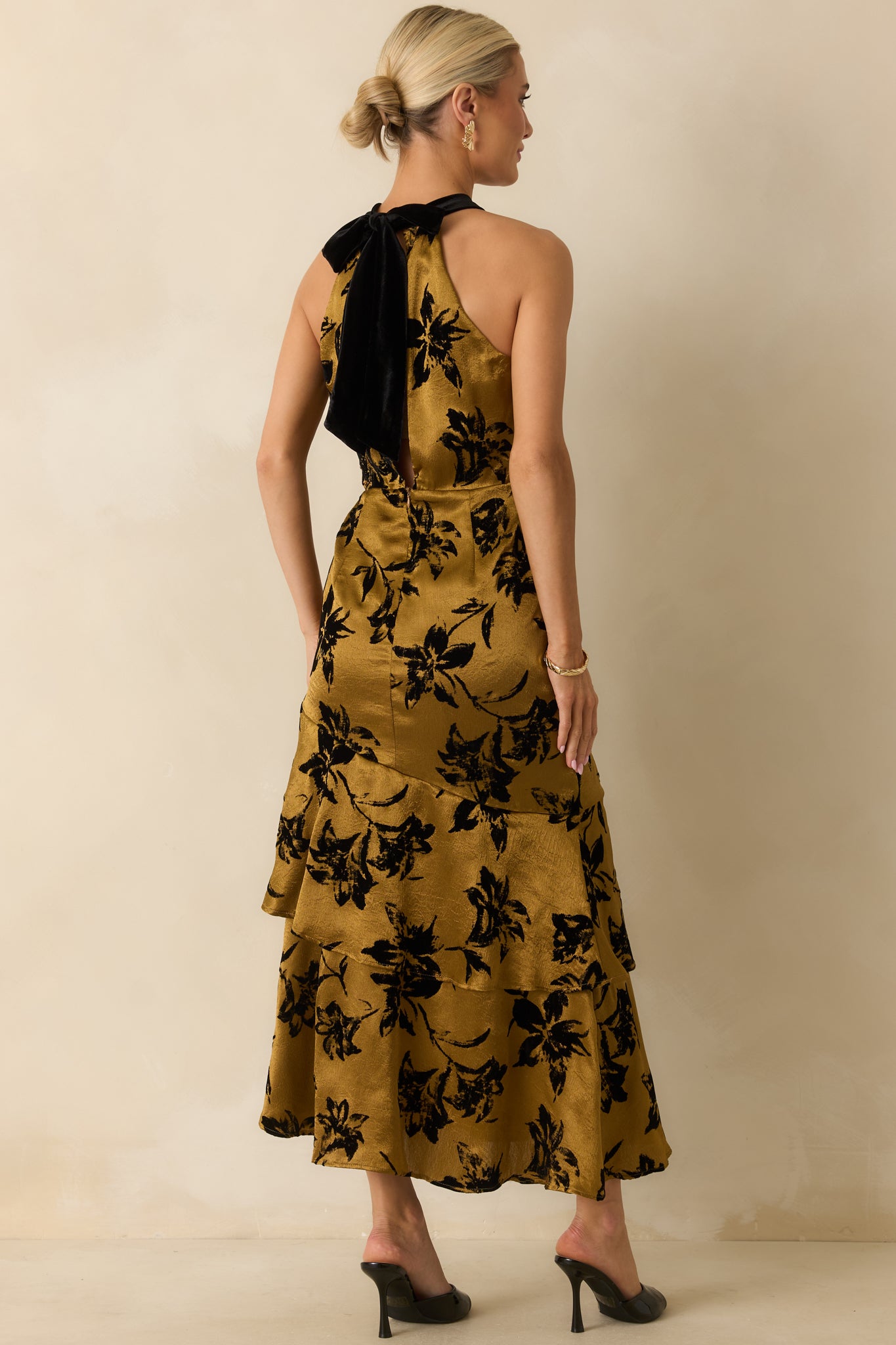 Back view of the dark gold floral satin dress featuring the black velvet tie bow and concealed zipper.