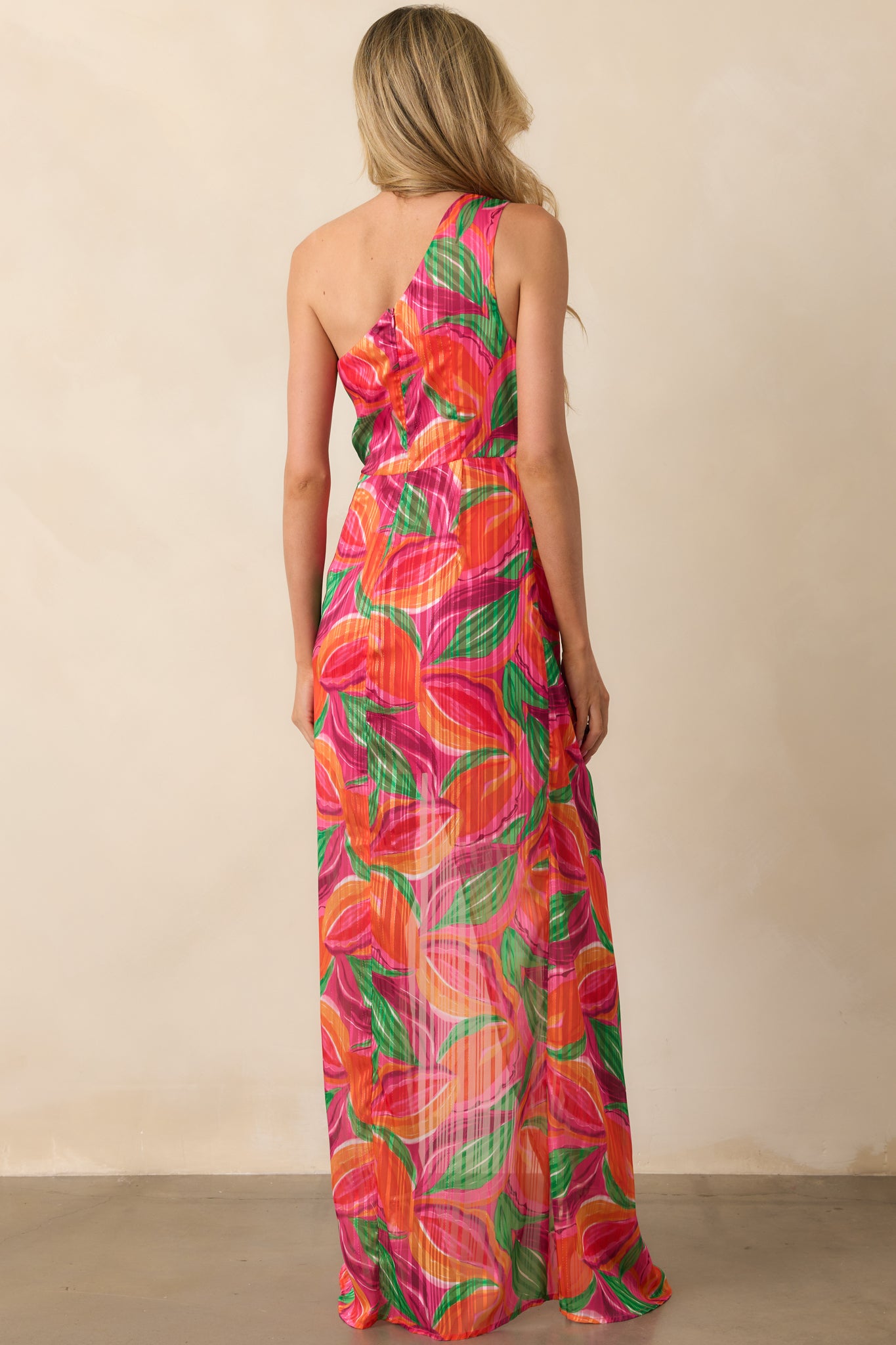 Back view of the dress displaying the hidden zipper and the continuation of the floral print across the back.