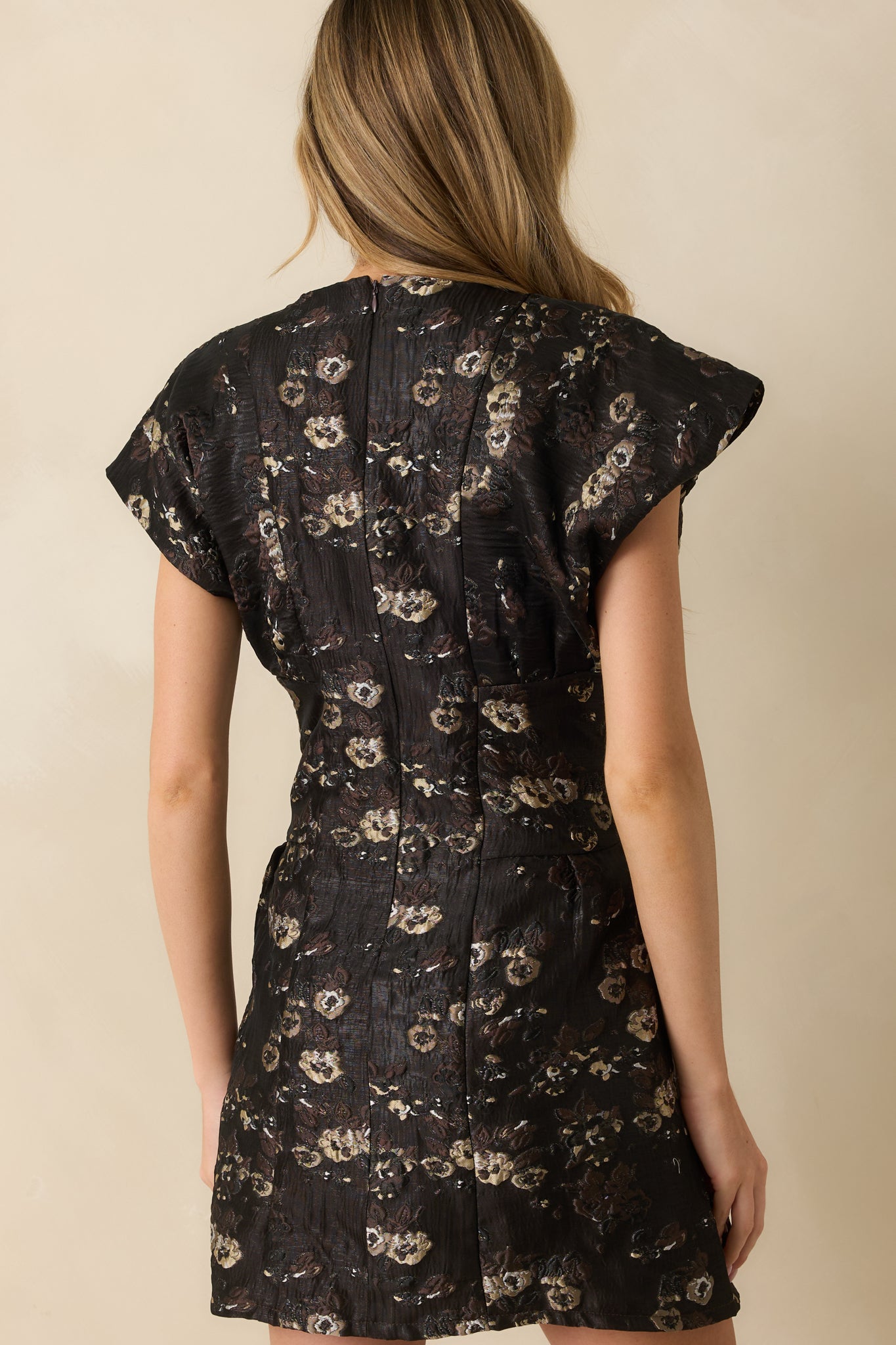 Back view of the dress highlighting the concealed zipper and fitted waistline.