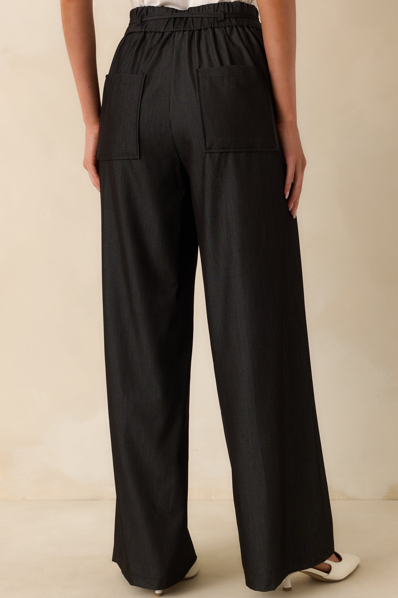 A view from behind showing the high rise waist, back pockets, and the elastic insert at the waistband.