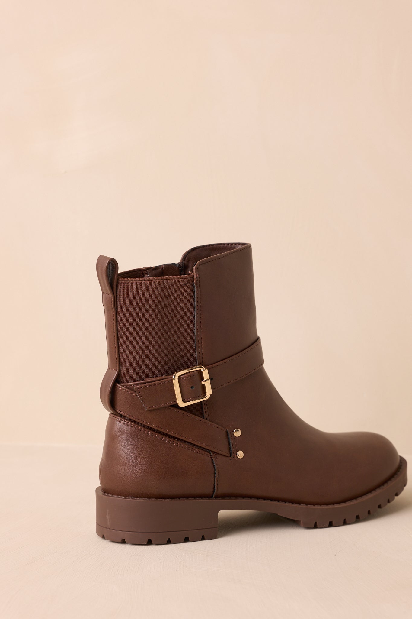 Another angled back view highlighting the straps, gold buckle, and sleek silhouette.