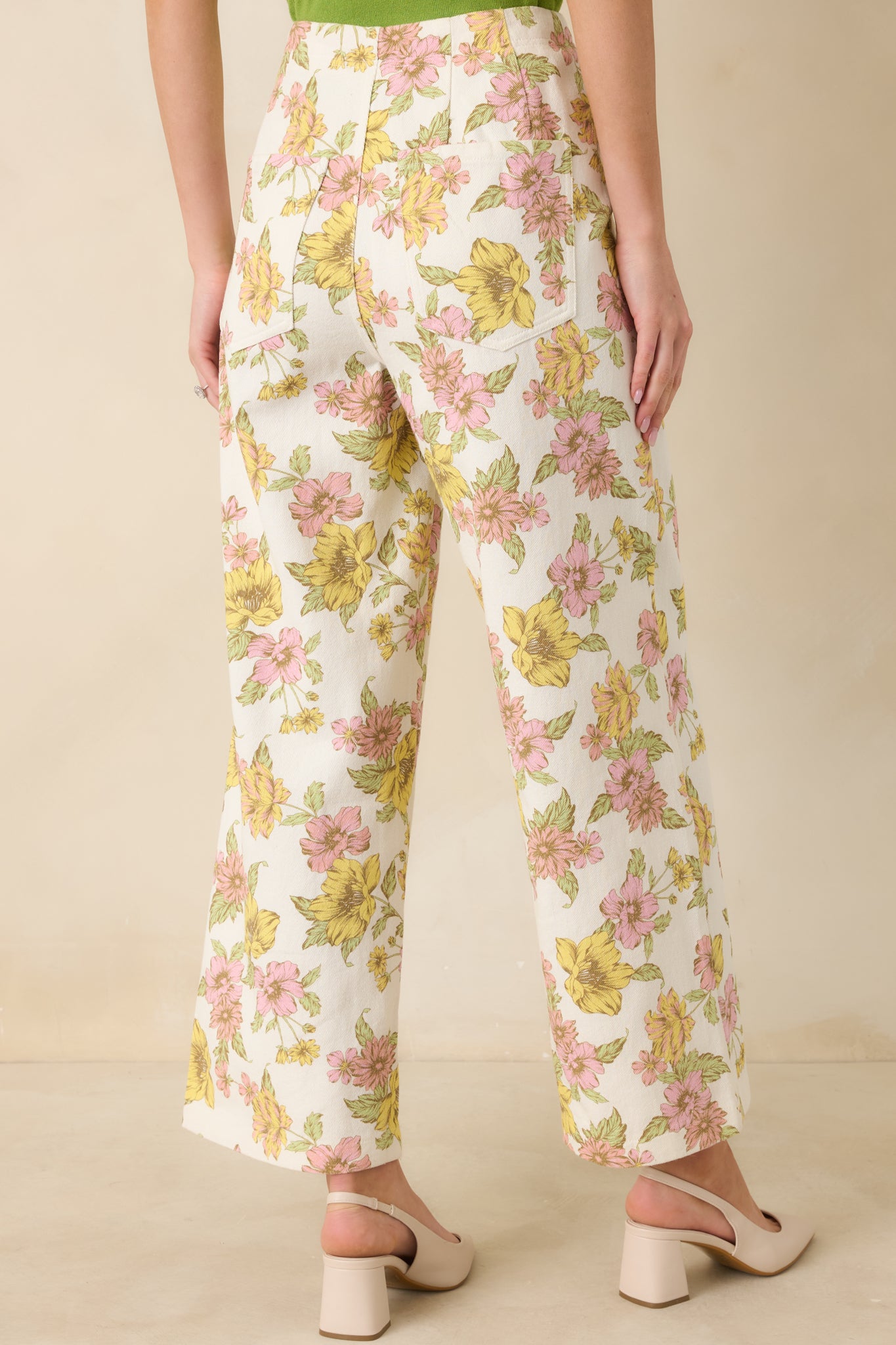 Back view of the floral pants highlighting the wide leg shape and clean back finish.