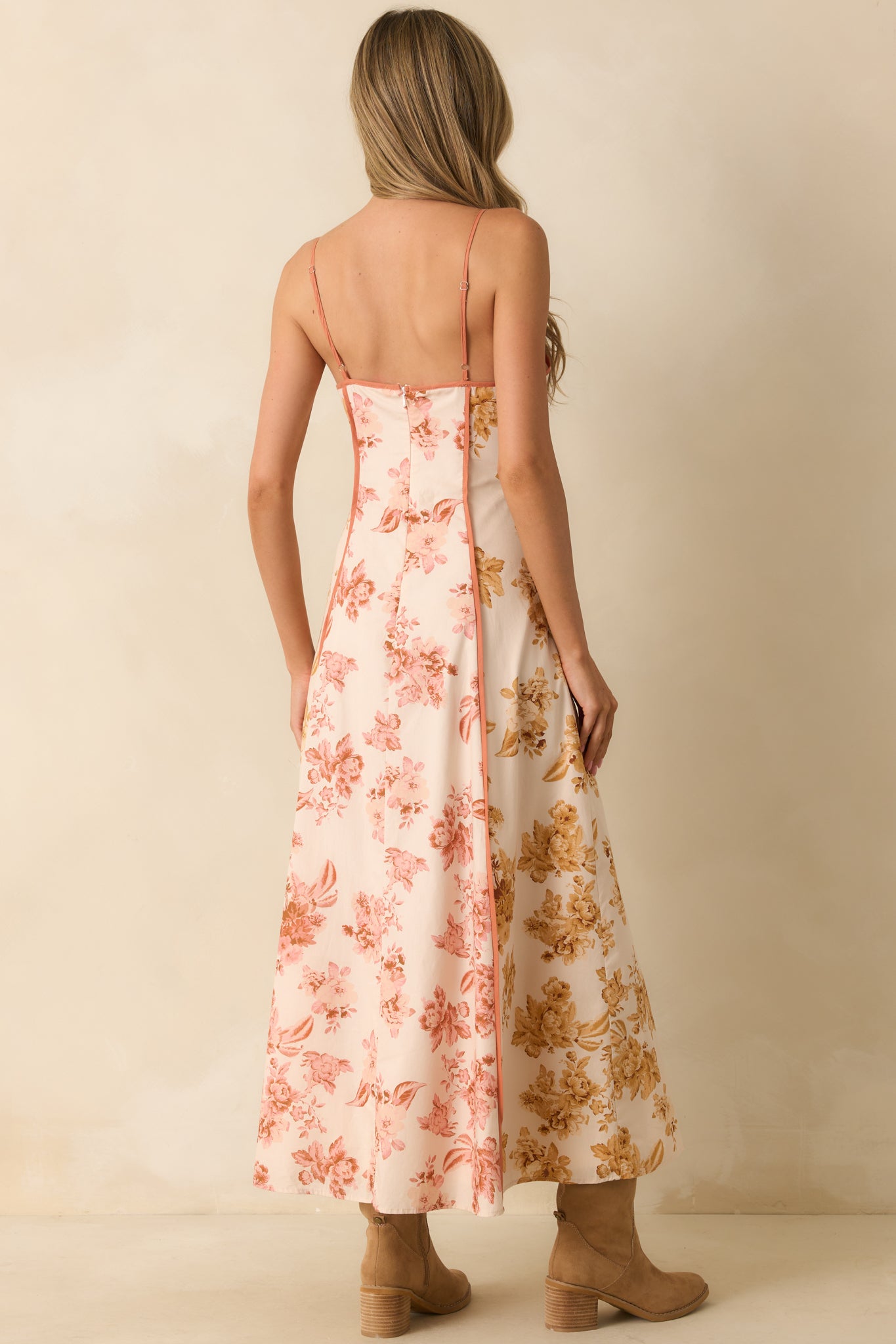 A back view of the maxi dress showing the hidden back zipper and adjustable spaghetti straps.