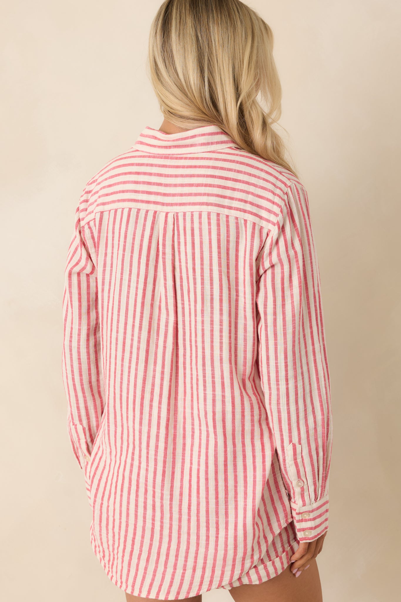 Back view of red striped cotton gauze shirt featuring a relaxed, slightly oversized silhouette and lightweight drape