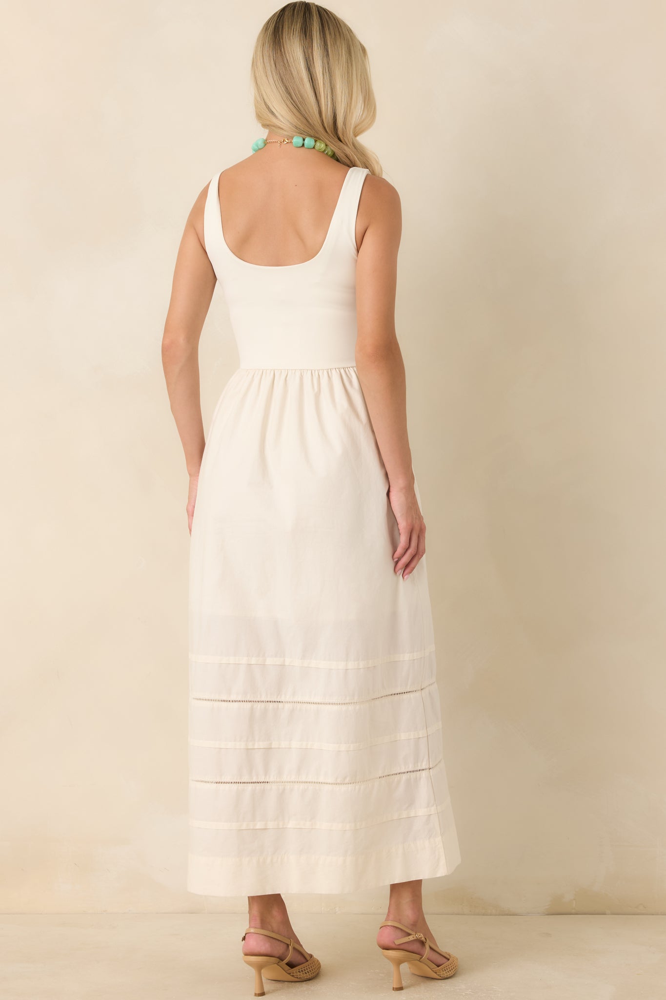 Back view of the fitted, stretchy bodice features a flattering scoop back, with the gathered cotton poplin skirt.