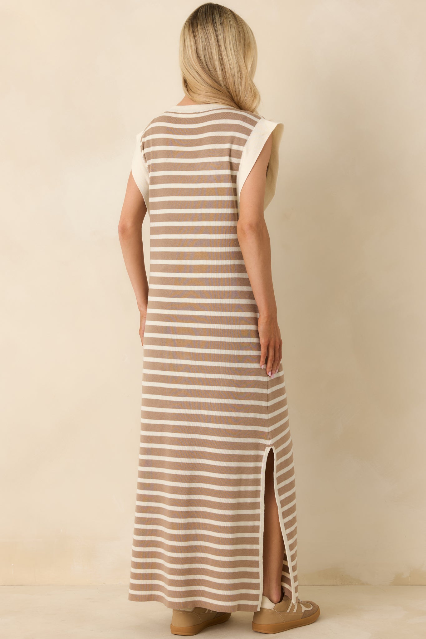 Back view of the taupe and ivory striped maxi dress showing the continuous stripe pattern and relaxed, sleeveless fit.