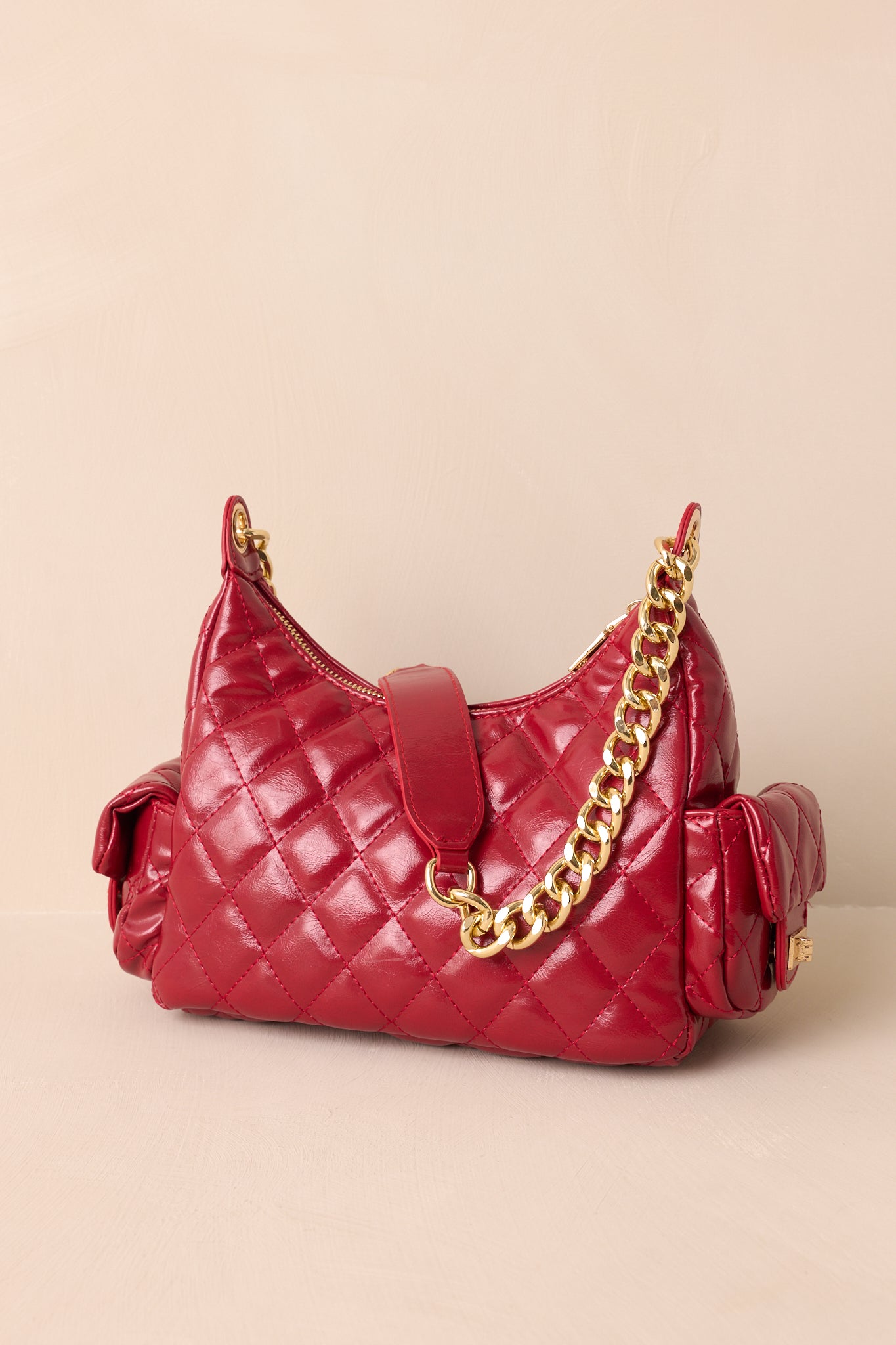 A back view of the handbag showing the quilted faux leather surface and clean structured silhouette.