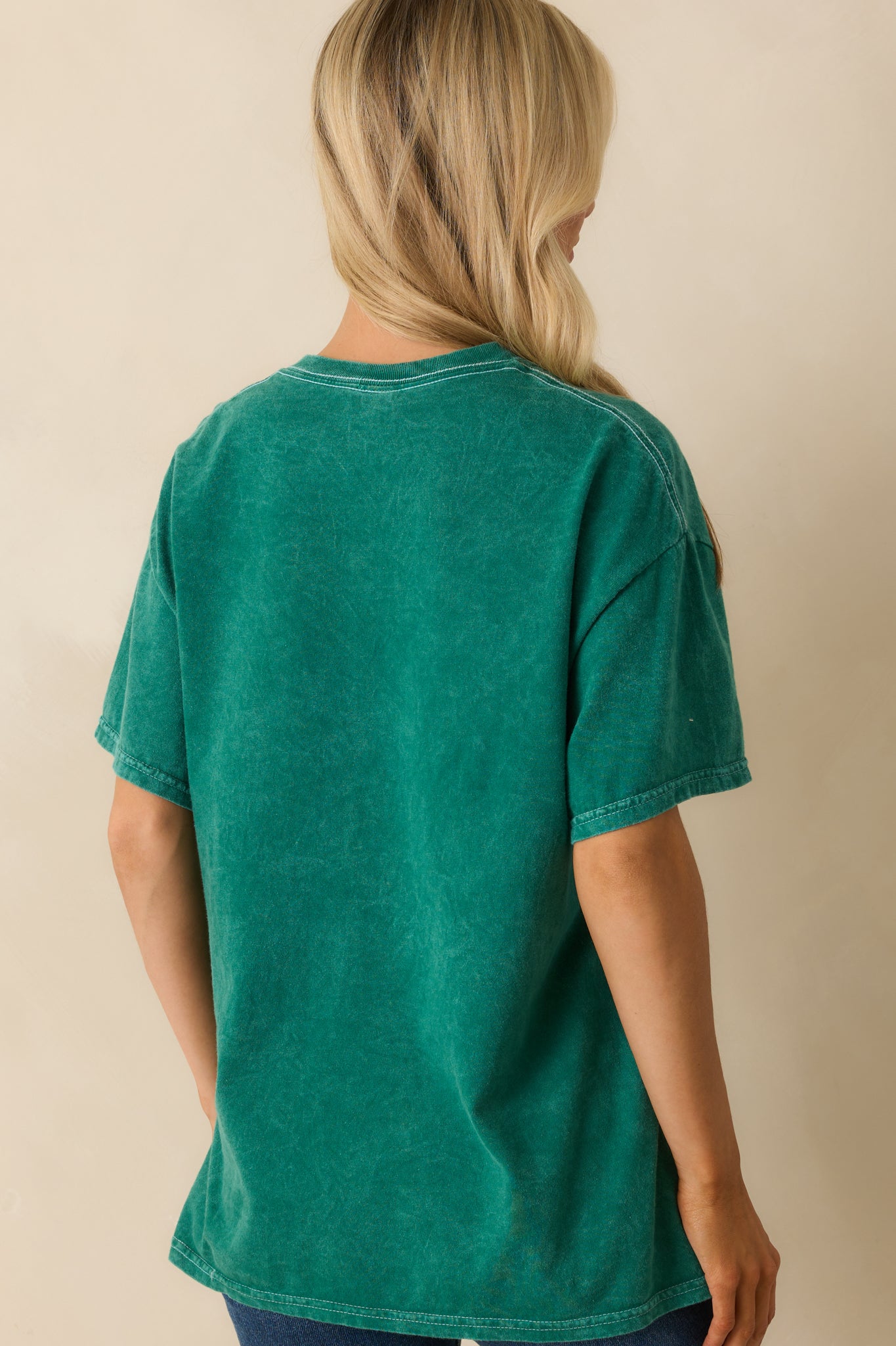 A back view of the tee showing the solid green acid wash color and relaxed fit.