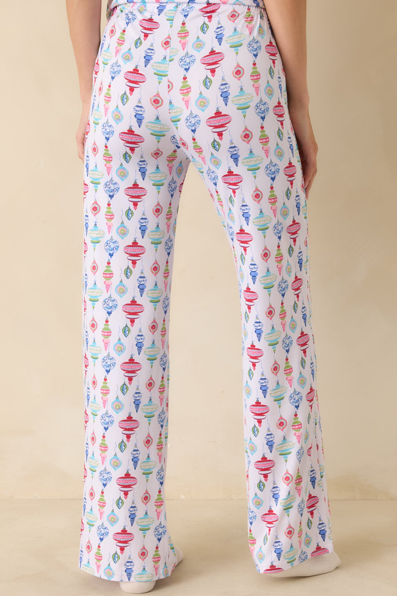 Back view of the pajama pants displaying the continuous ornament print and relaxed silhouette.