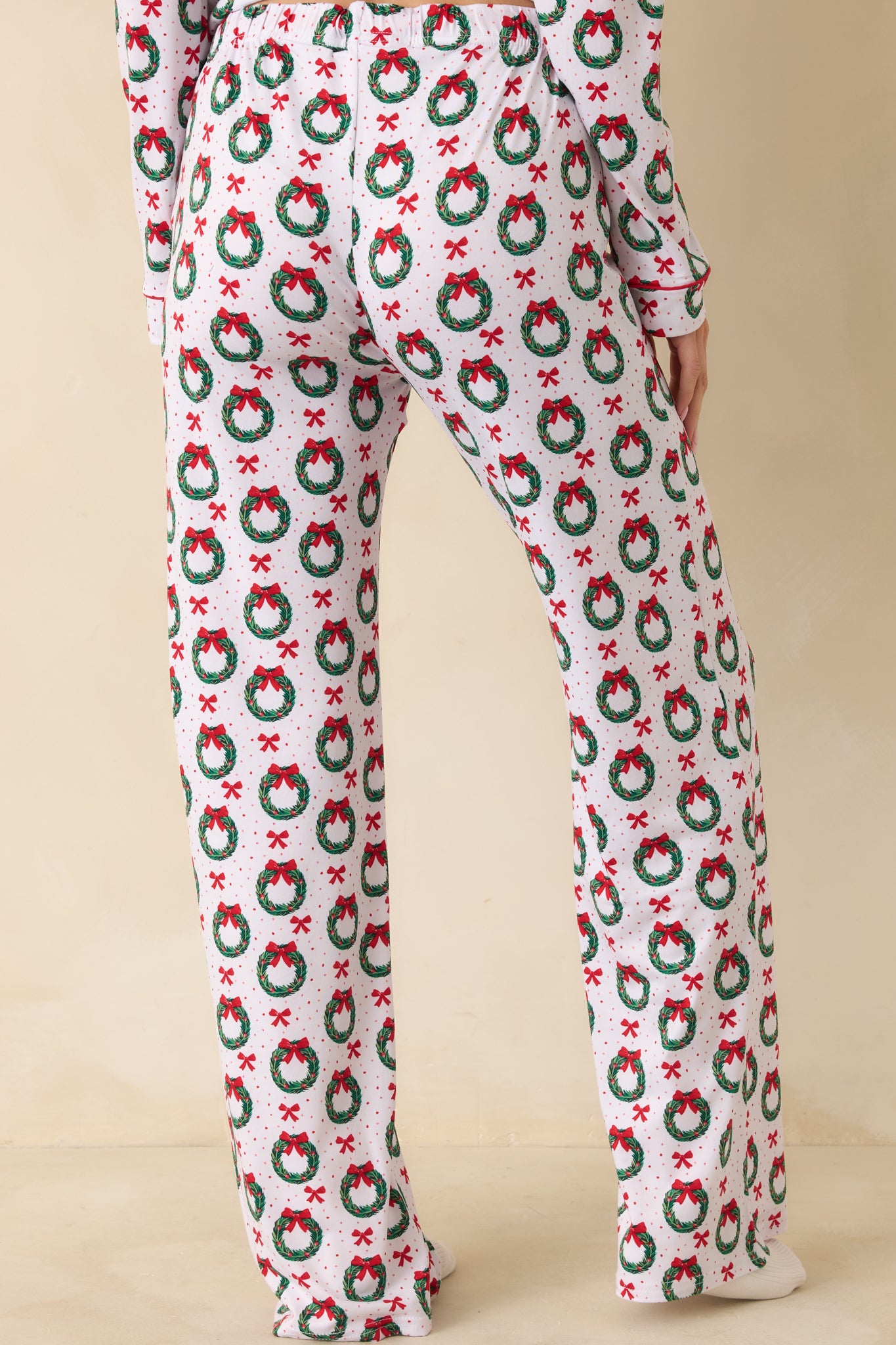 Back view of the pajama pants showing the straight-leg fit, side pockets, and consistent allover print.