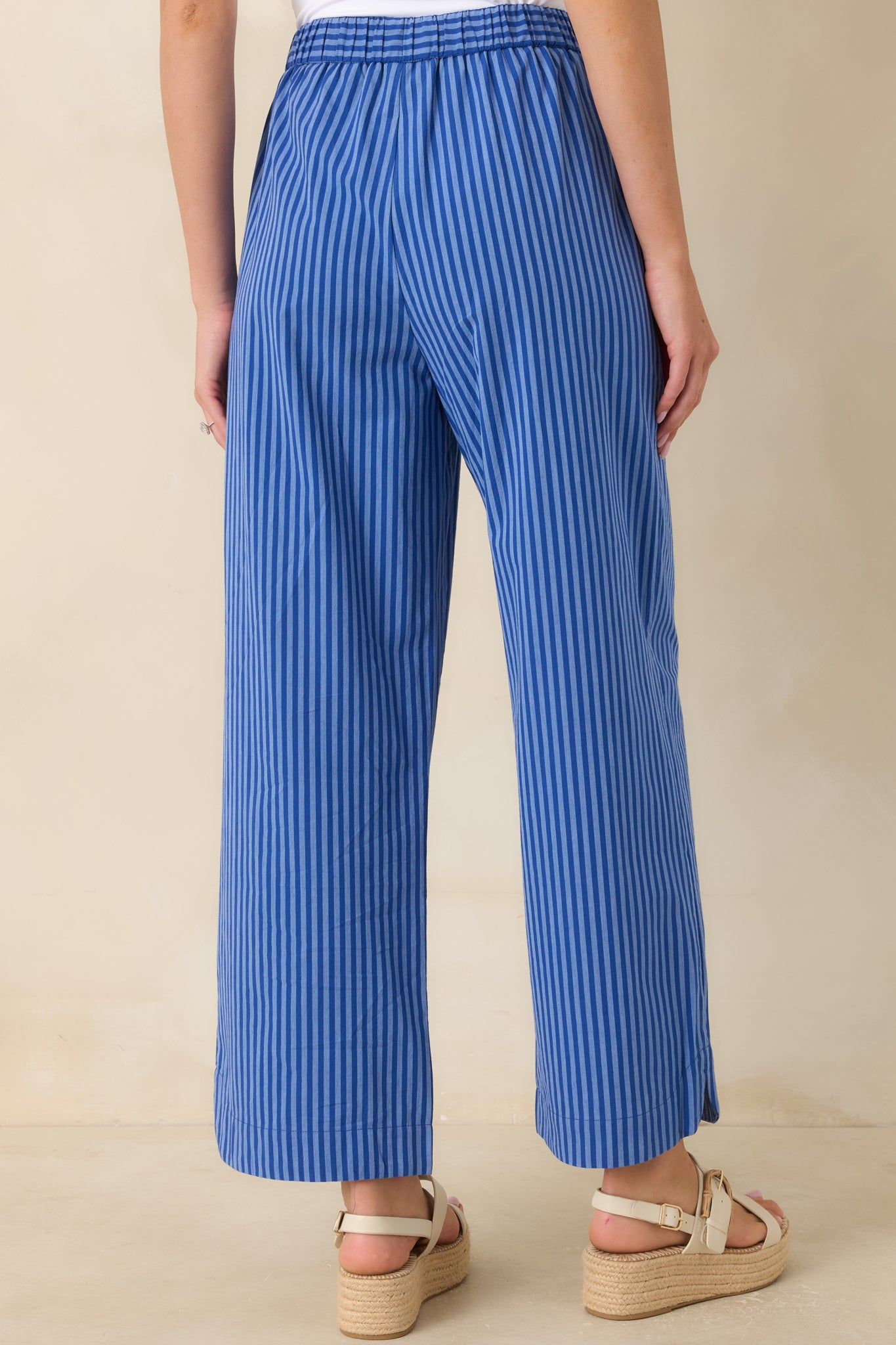 Back view of the electric blue striped pants showcasing the relaxed wide-leg silhouette and comfortable pull-on waistband.