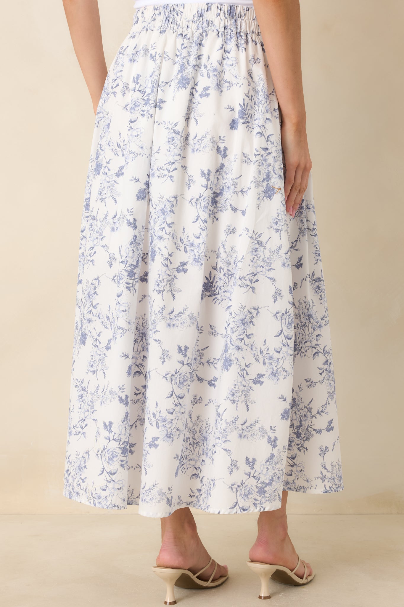 Back view of the skirt showing the elasticized high-rise waistband and softly gathered full-length silhouette.