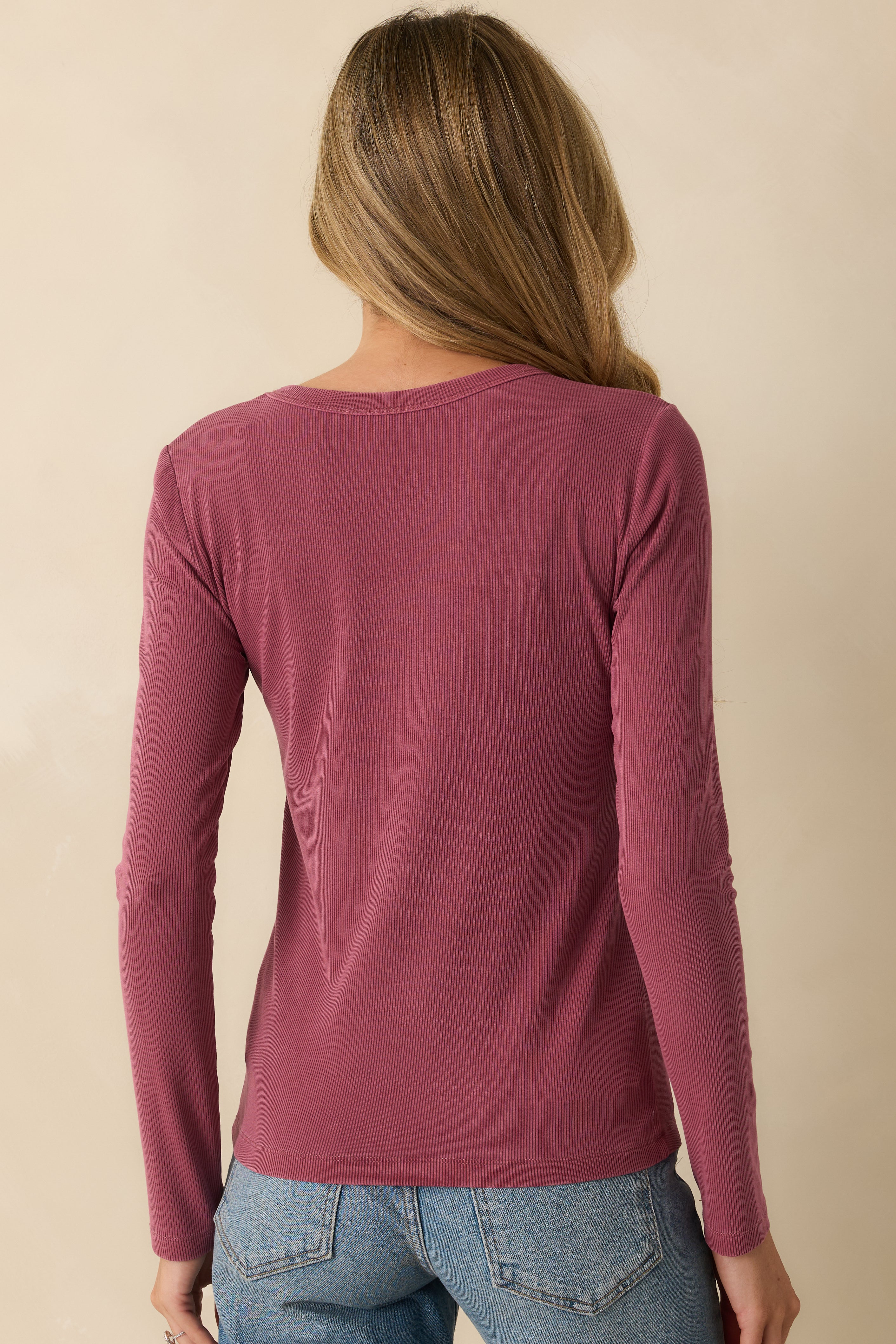 Back view showing the long sleeves, straight hem, and overall relaxed silhouette.