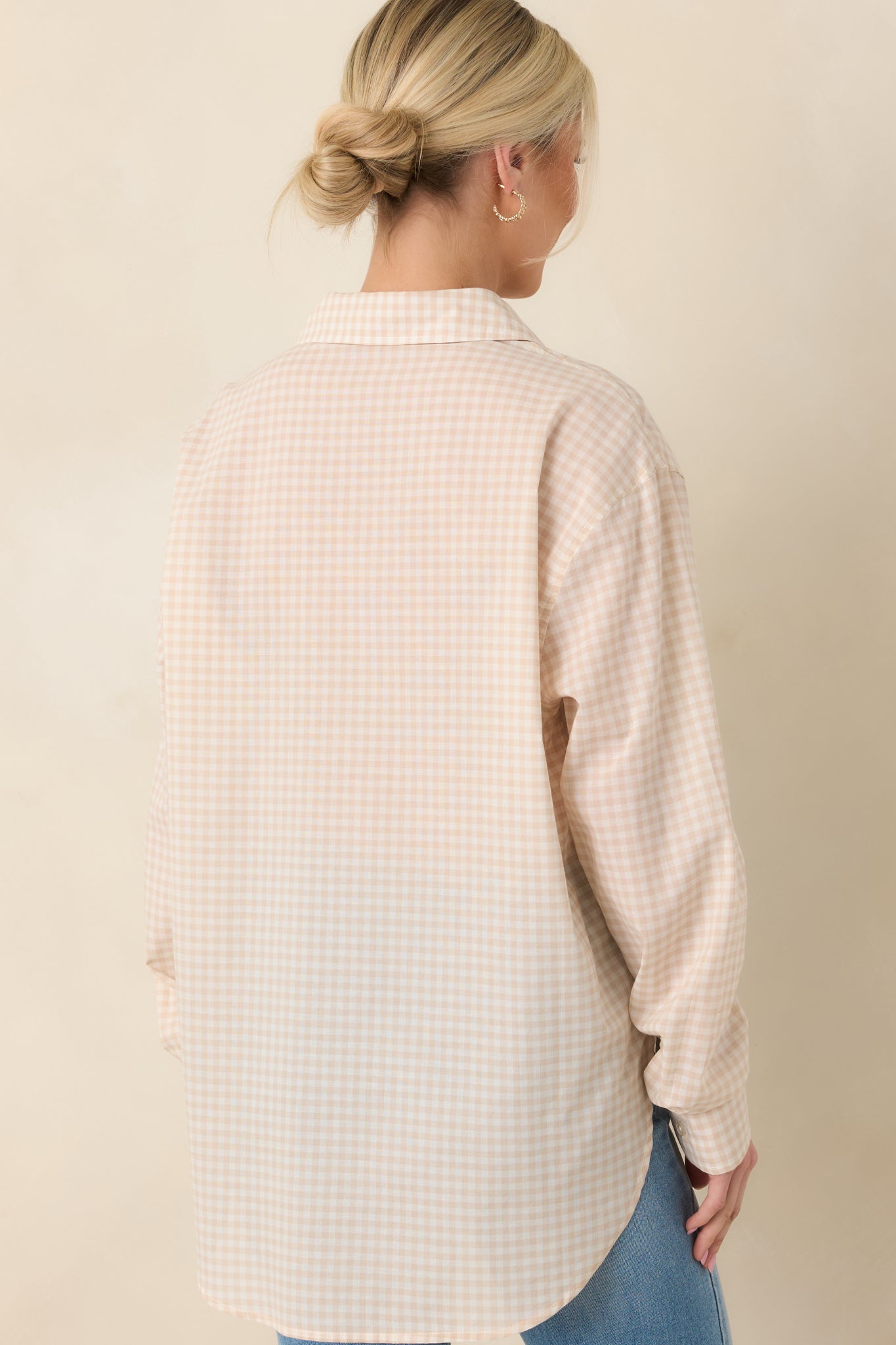 Back view of beige gingham top showing the relaxed fit and gently curved hemline.