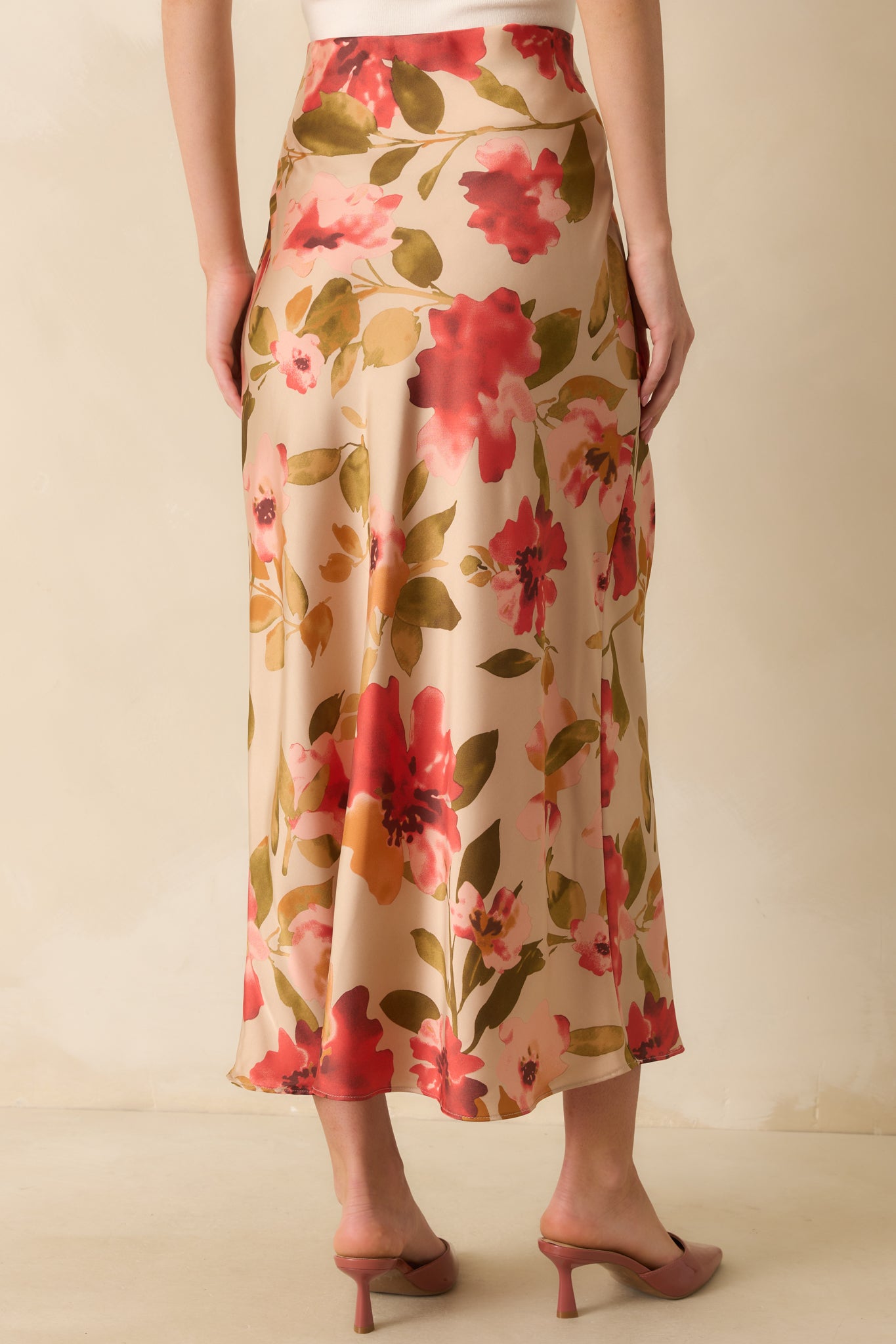 Rear view of the tan maxi skirt showing the high-rise waistband and hidden side zipper closure.